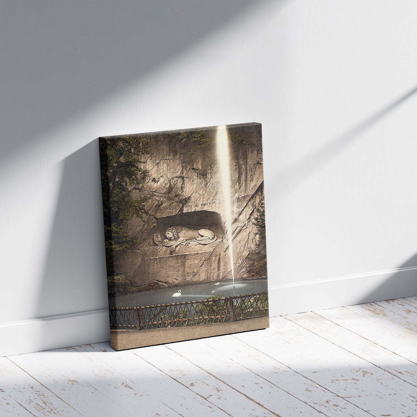 A picture of Lion Monument, and fountain, Lucerne, Switzerland, a mockup of the print leaning against a wall