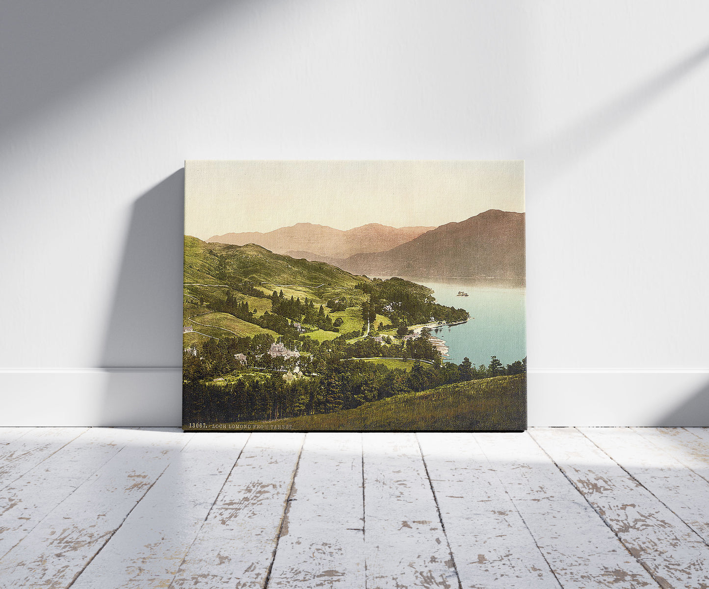 A picture of Loch Lomond from Tarbet, Scotland, a mockup of the print leaning against a wall