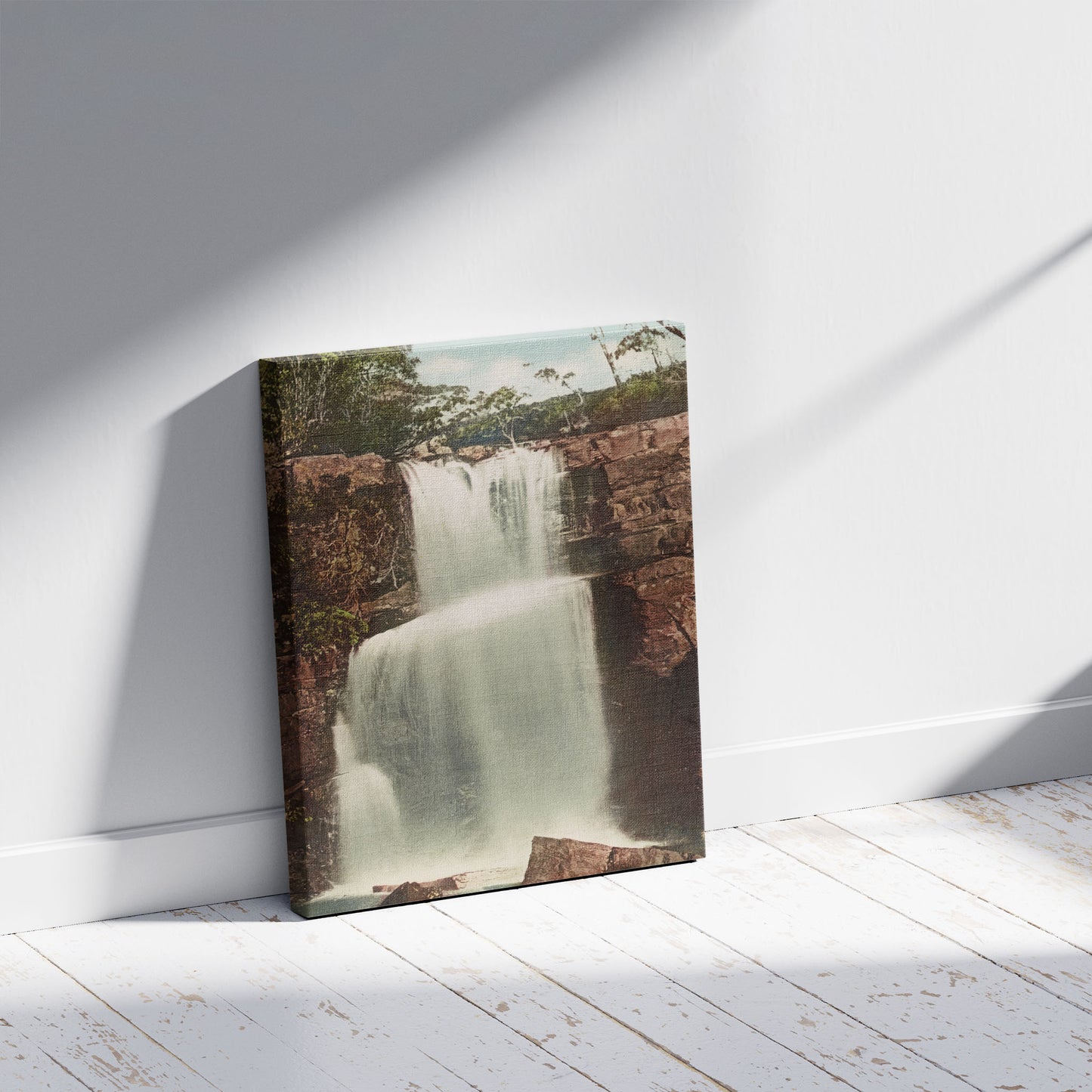 A picture of Lower Lodden Falls, near Bulli, N.S.W., a mockup of the print leaning against a wall