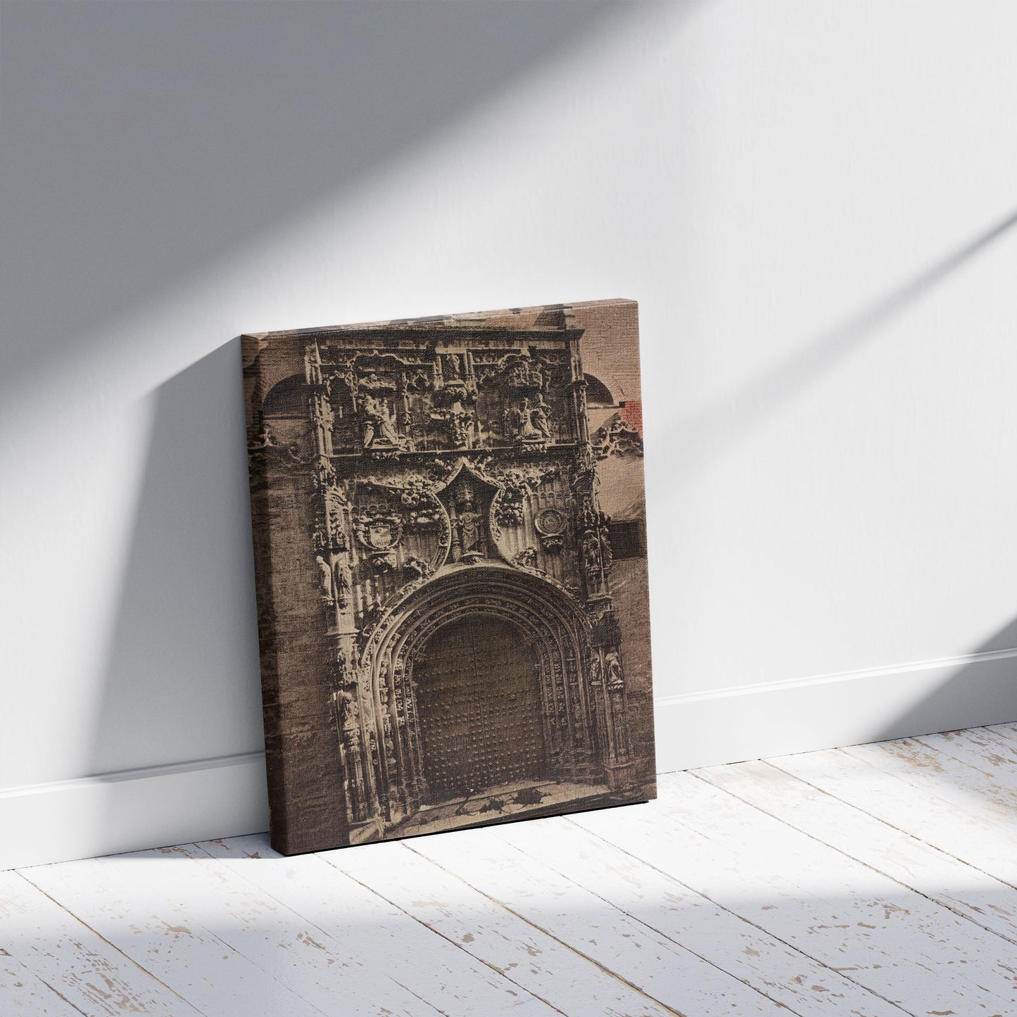 A picture of Málaga. Puerta del Sagracio, a mockup of the print leaning against a wall