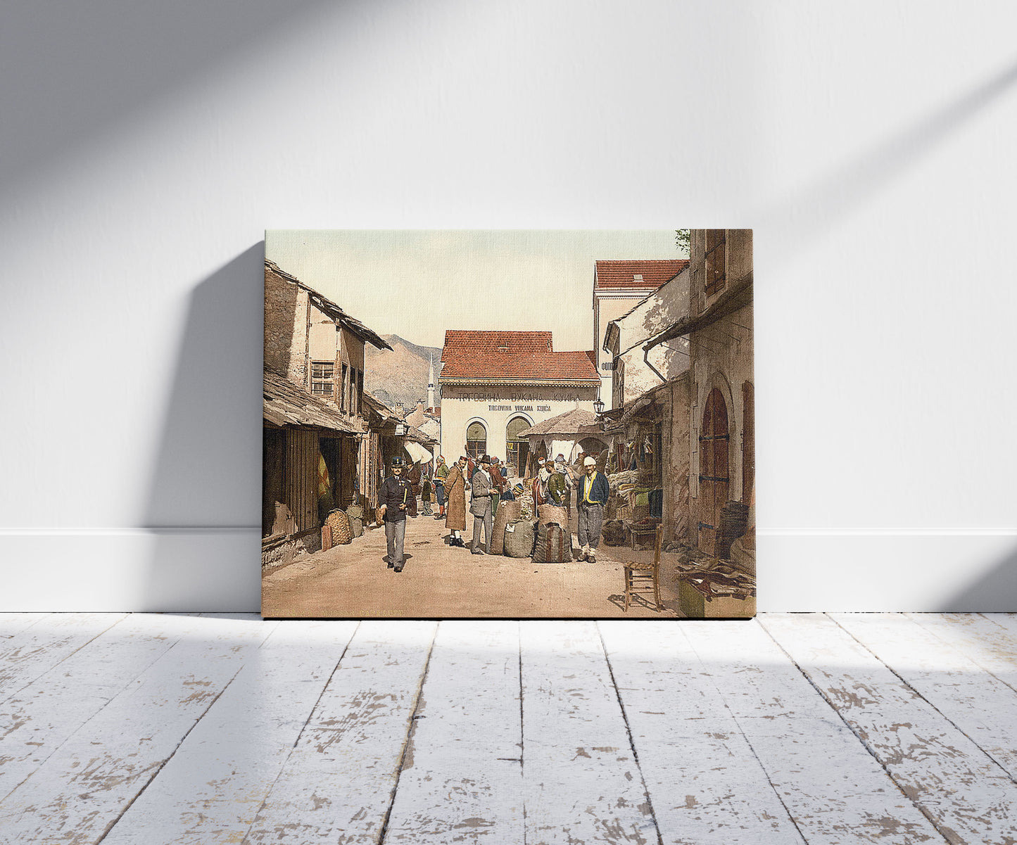 A picture of Mostar, Cafe Luft, Herzegowina, Austro-Hungary, a mockup of the print leaning against a wall