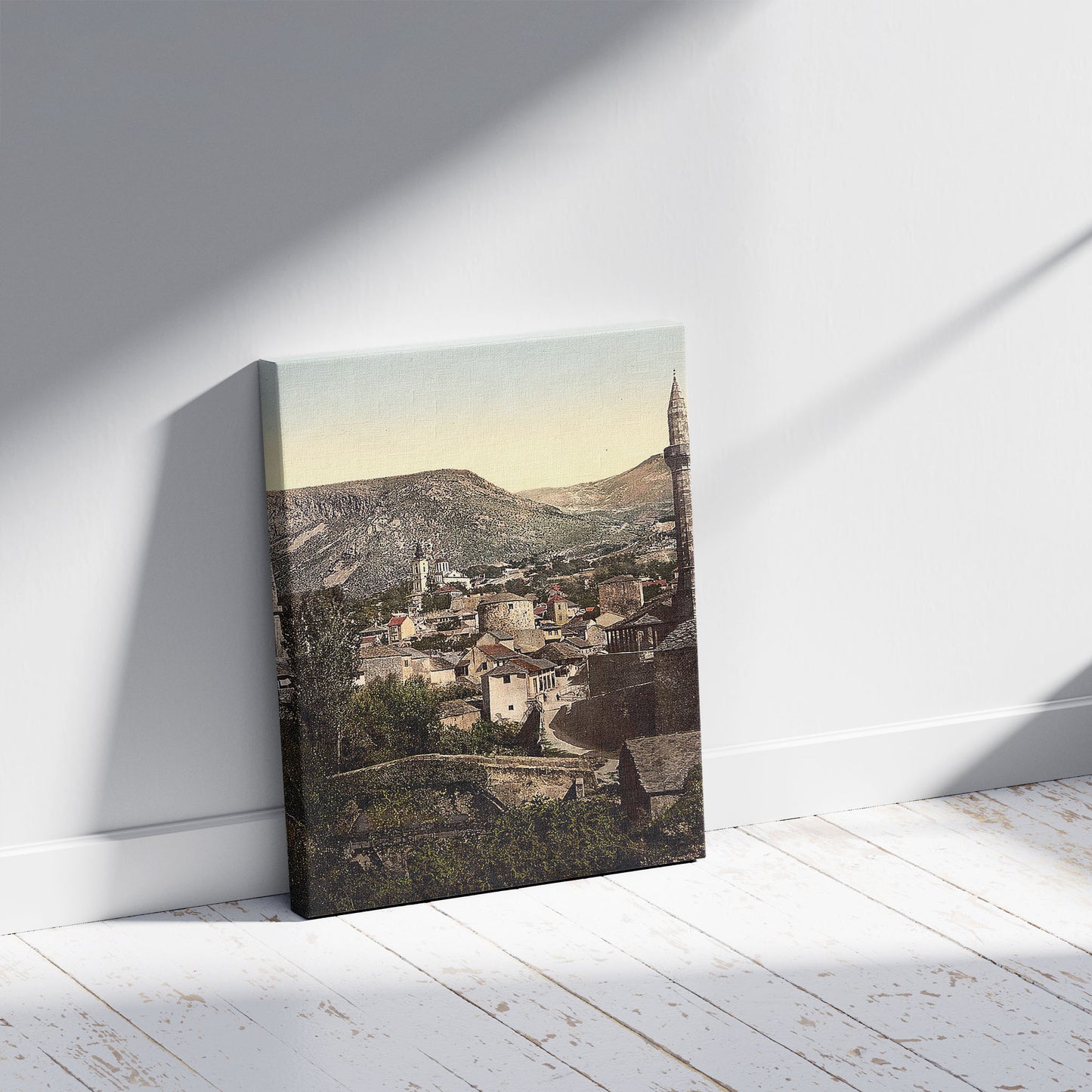 A picture of Mostar, Muhlen Bridge, Herzegowina, Austro-Hungary, a mockup of the print leaning against a wall