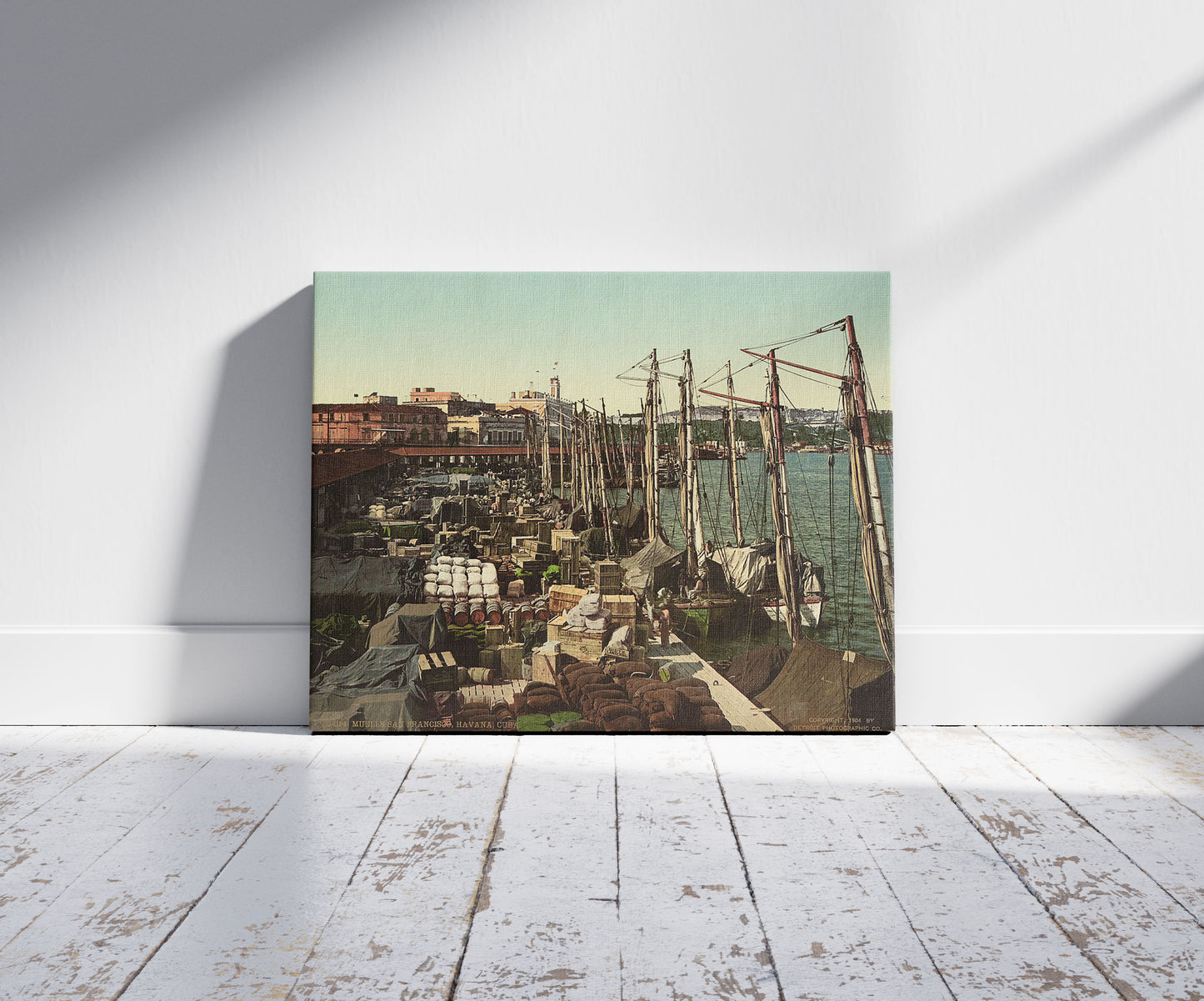 A picture of Muelle San Francisco, Havana, Cuba, a mockup of the print leaning against a wall