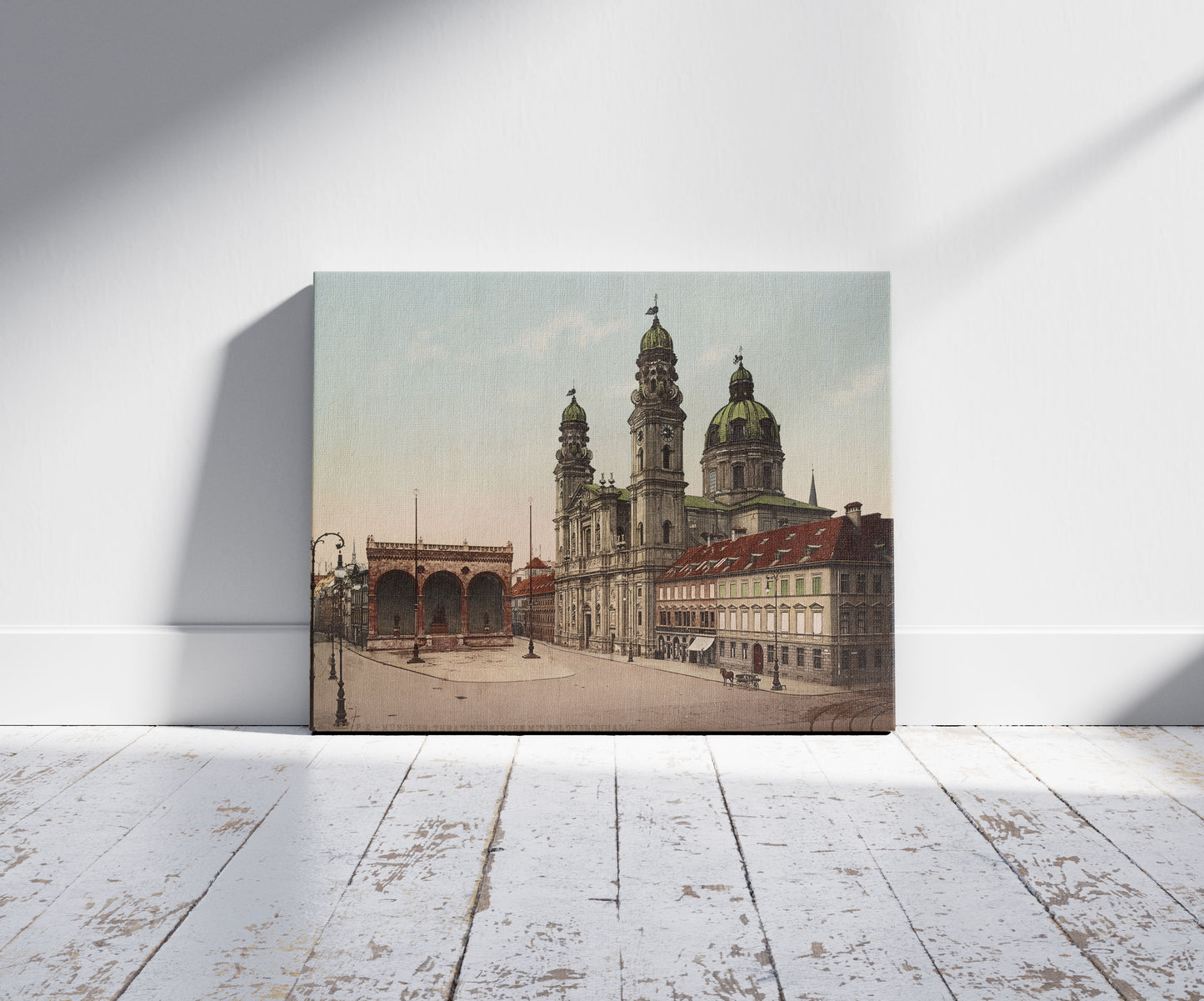 A picture of München. Theatinerkirche mit Feldherrnhalle, a mockup of the print leaning against a wall