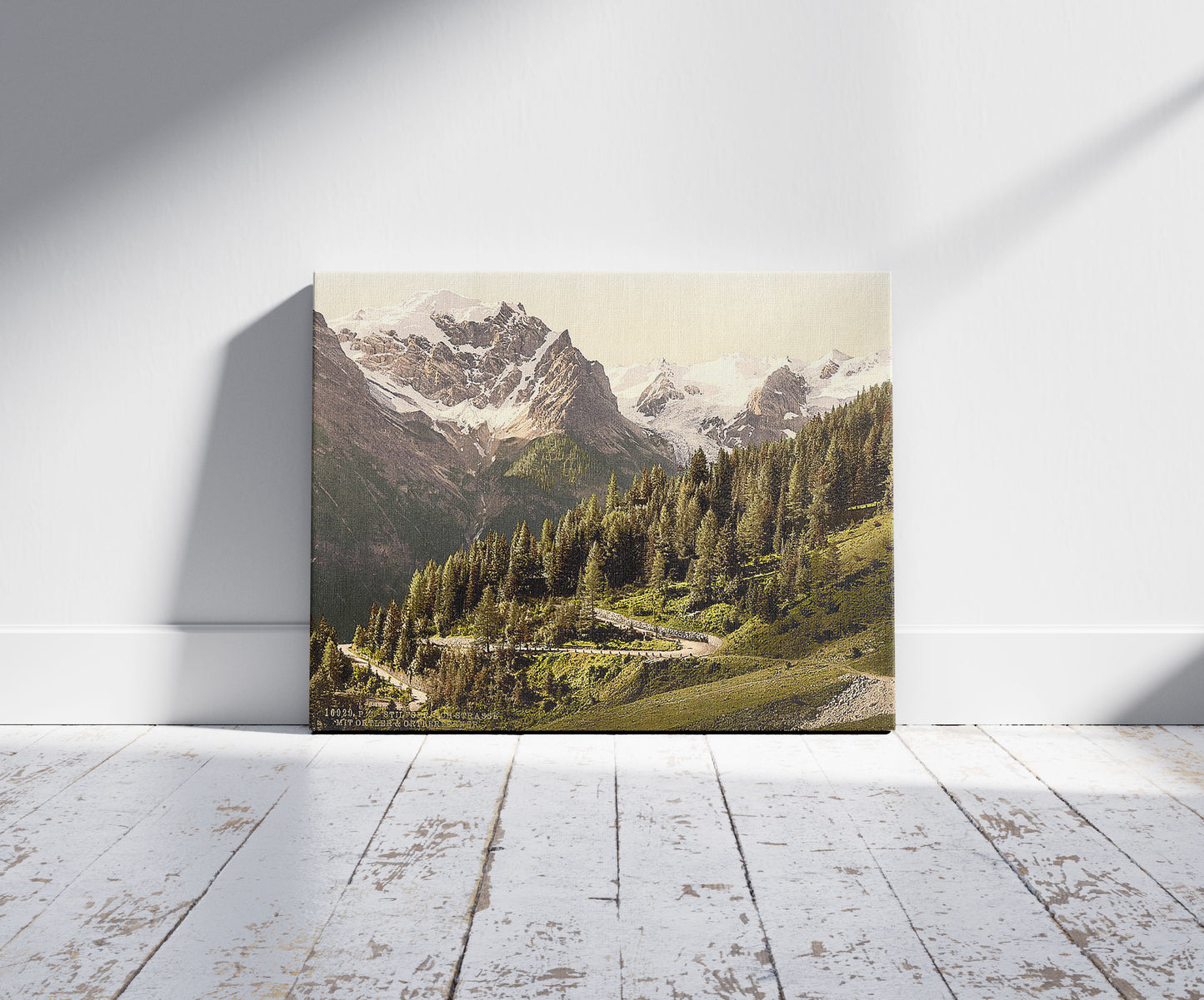 A picture of Ortler Territory, Stilfserjoch (i.e., Stilfer Joch), with Ortler and Ortlerferner, Tyrol, Austro-Hungary, a mockup of the print leaning against a wall