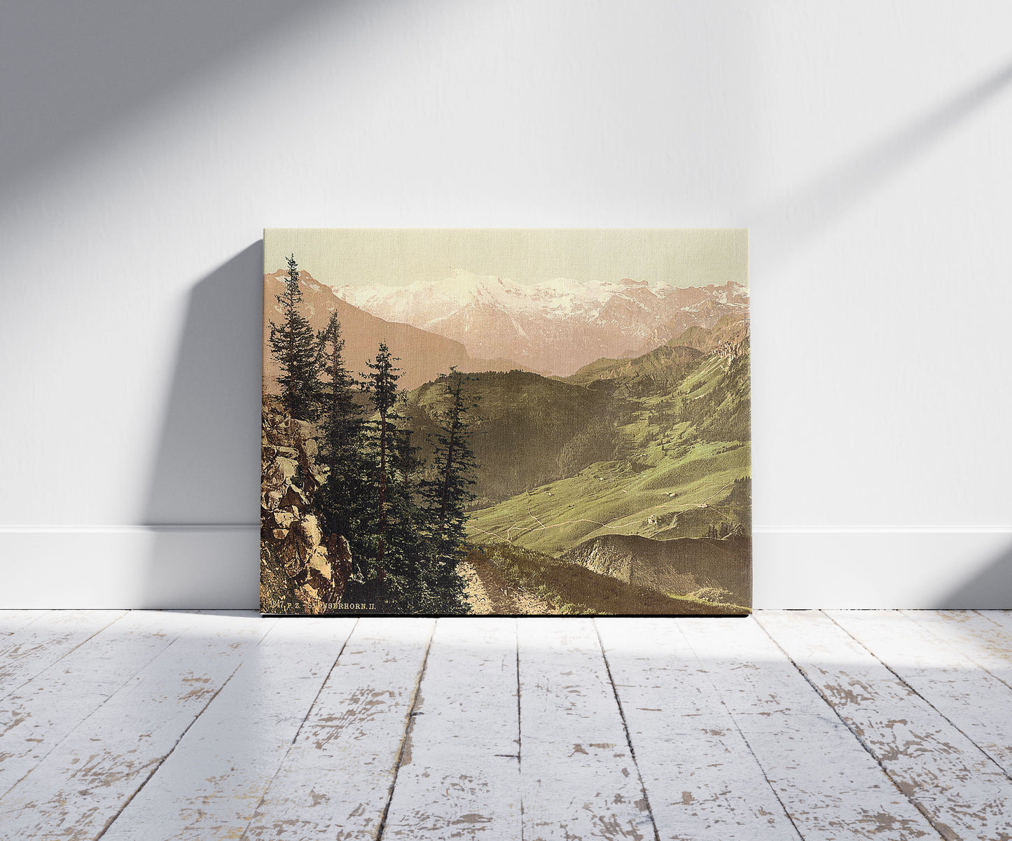A picture of Panoramic view towards Titlis, Stanserhorn, Switzerland, a mockup of the print leaning against a wall