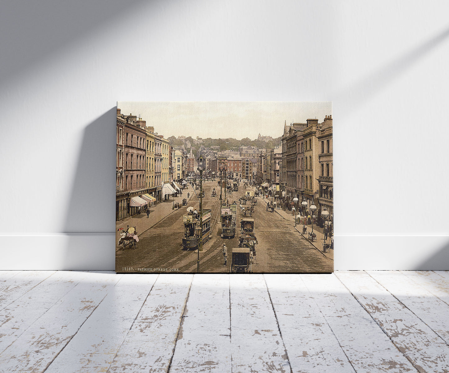 A picture of Patrick Street (i.e., St. Patrick Street), Cork. County Cork, Ireland, a mockup of the print leaning against a wall