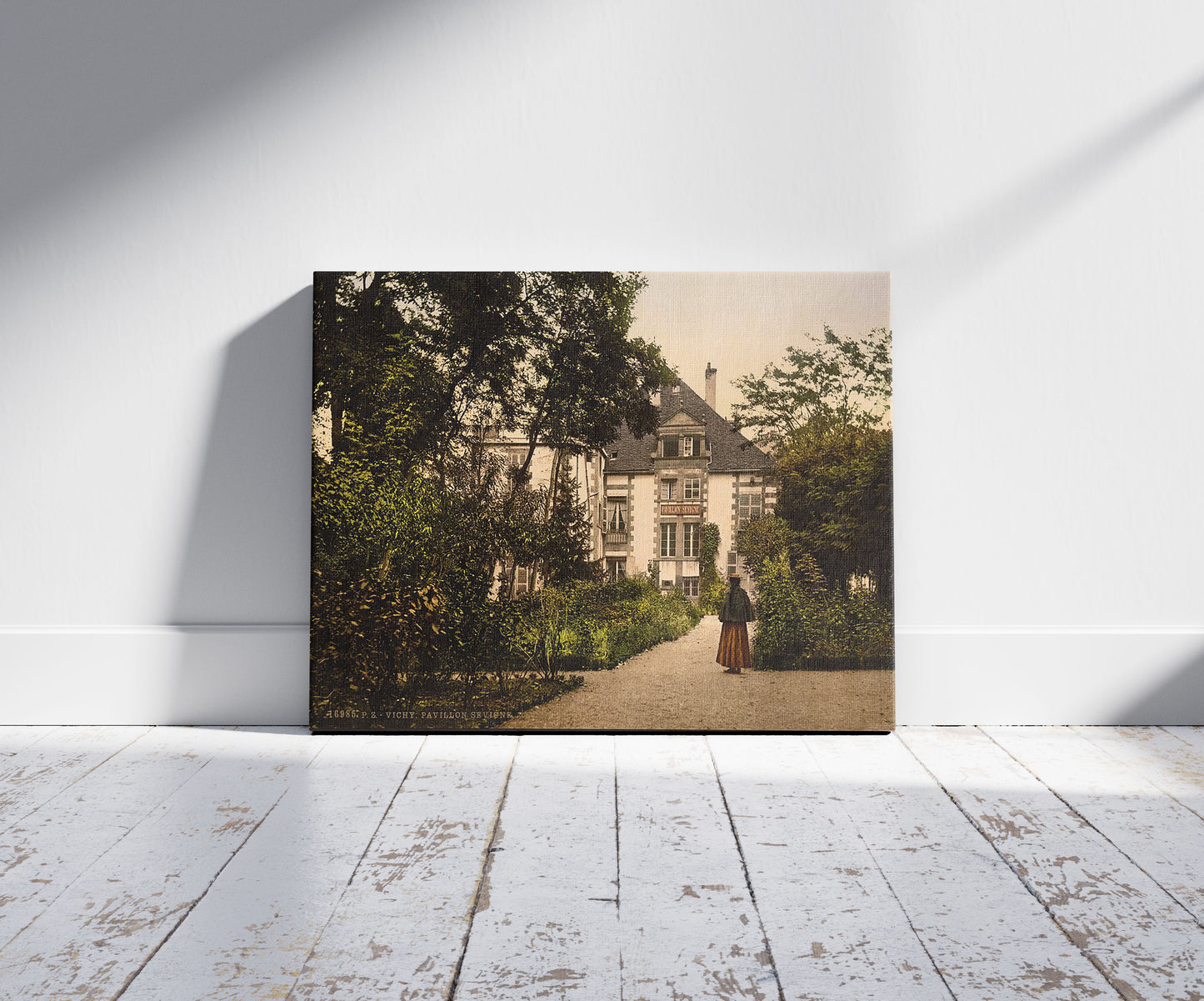 A picture of Pavilion Sevgne (i.e., Sévigné), Vichy, France, a mockup of the print leaning against a wall