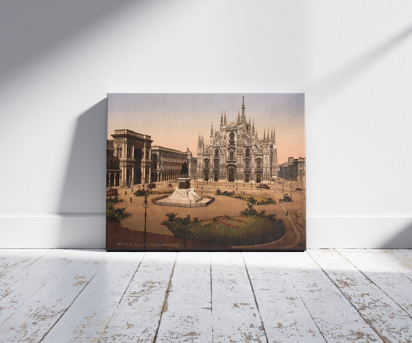 A picture of Piazza del Duomo, Milan, Italy, a mockup of the print leaning against a wall