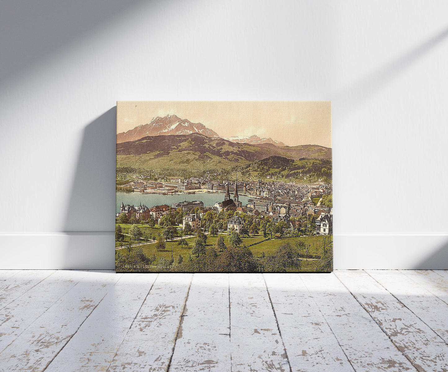 A picture of Pilatus and Lucerne, seen from Drei Linden, Lucerne, Switzerland, a mockup of the print leaning against a wall