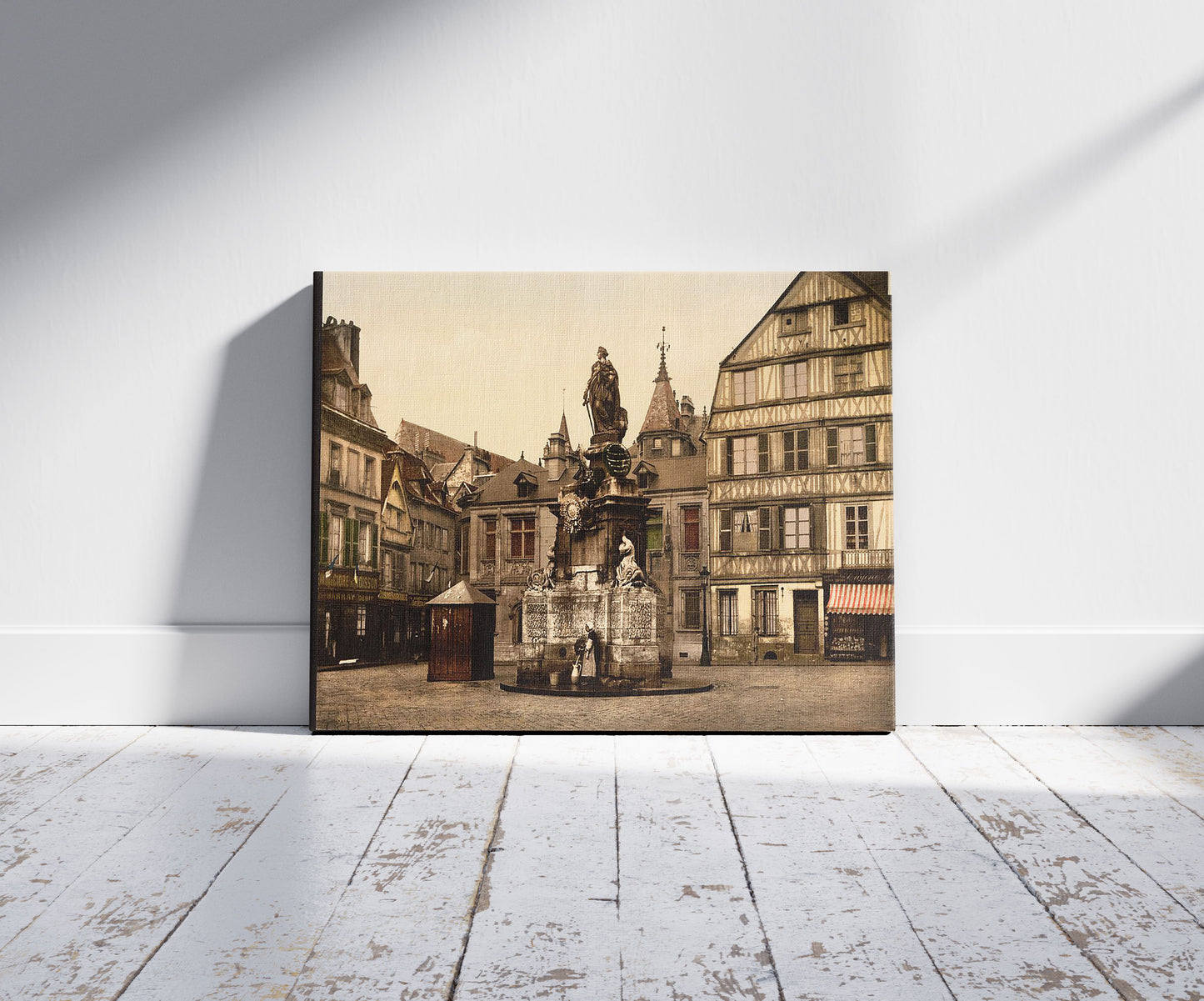 A picture of Place de la Pucelle, Rouen, France, a mockup of the print leaning against a wall