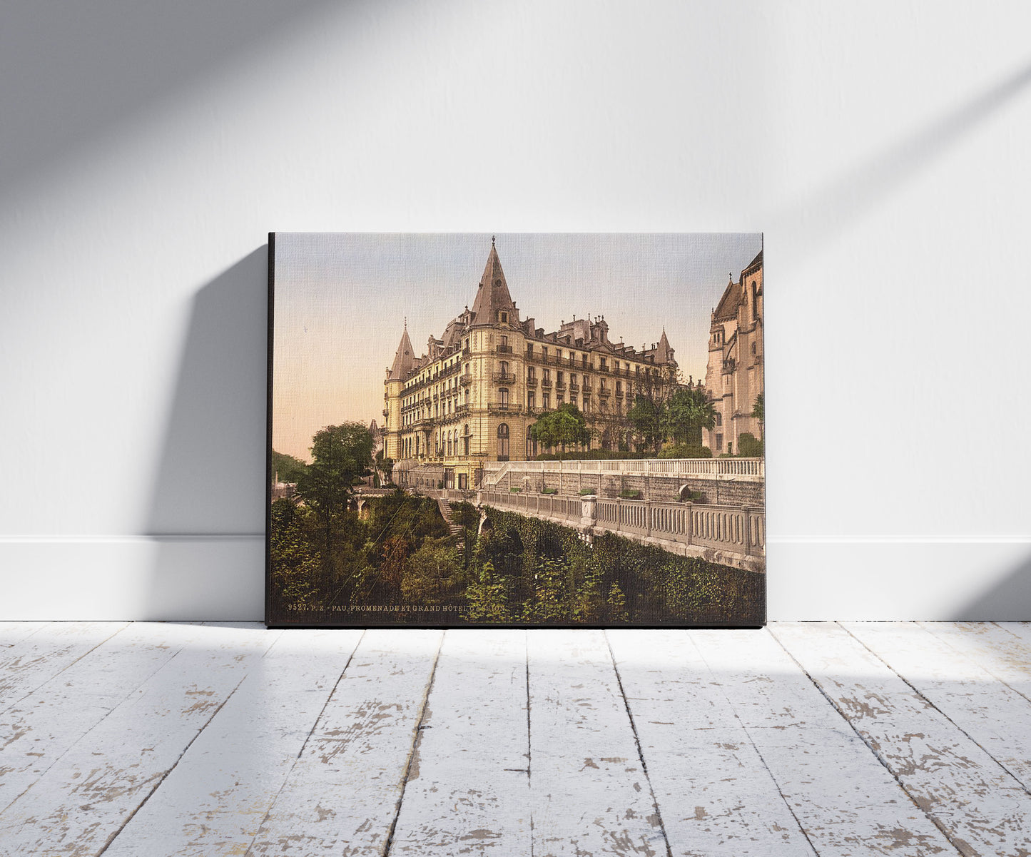 A picture of Promenade and Grand Hotel Gassion, Pau, Pyrenees, France, a mockup of the print leaning against a wall