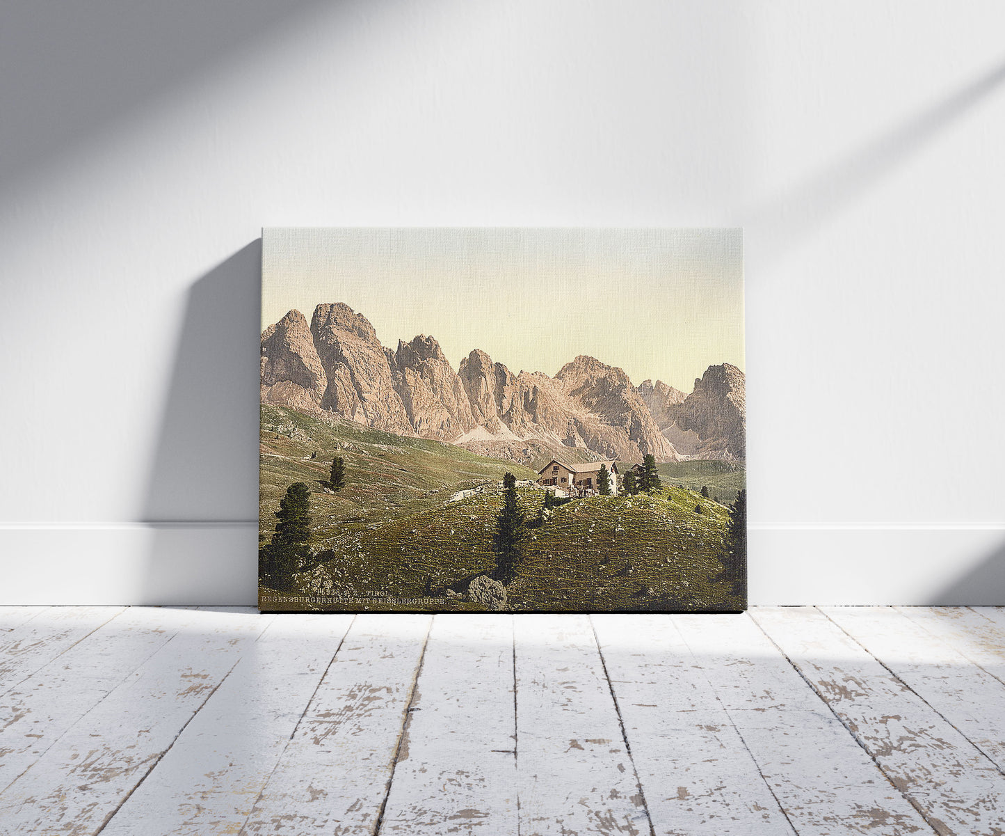 A picture of Regensburgerhutte with Geisslergruppe, Tyrol, Austro-Hungary, a mockup of the print leaning against a wall