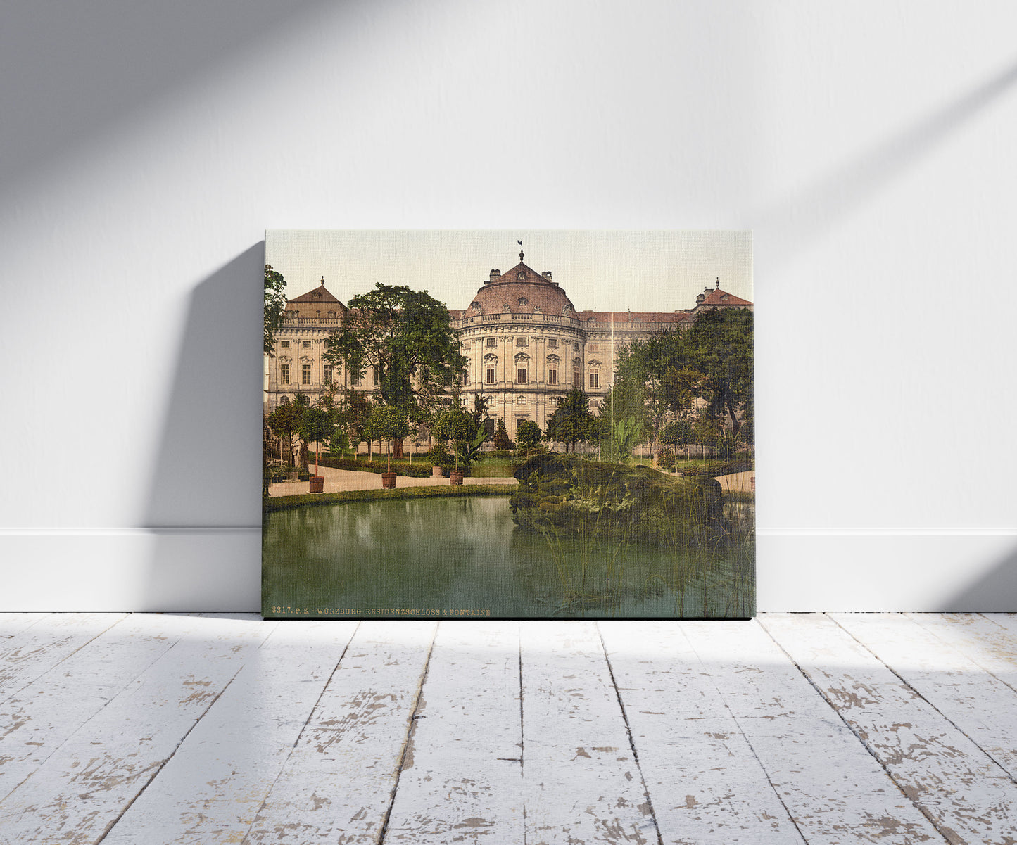 A picture of Residence and fountain, Wurzburg, Bavaria, Germany, a mockup of the print leaning against a wall
