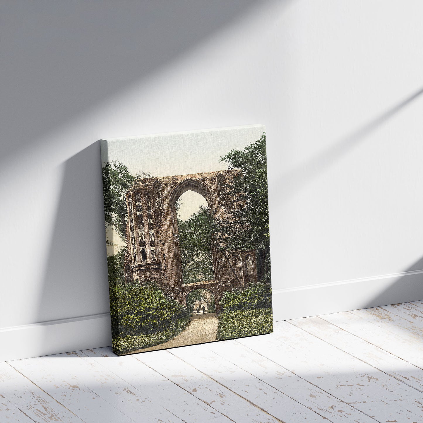 A picture of Ruins of Eldena, Griefswald (i.e., Greifswald), Pomerania, Germany, a mockup of the print leaning against a wall