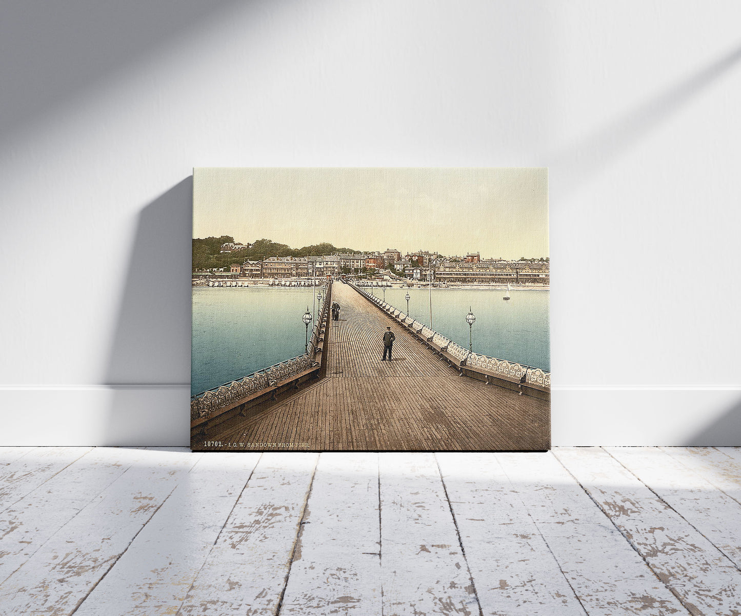 A picture of Sandown from pier, Isle of Wight, England, a mockup of the print leaning against a wall