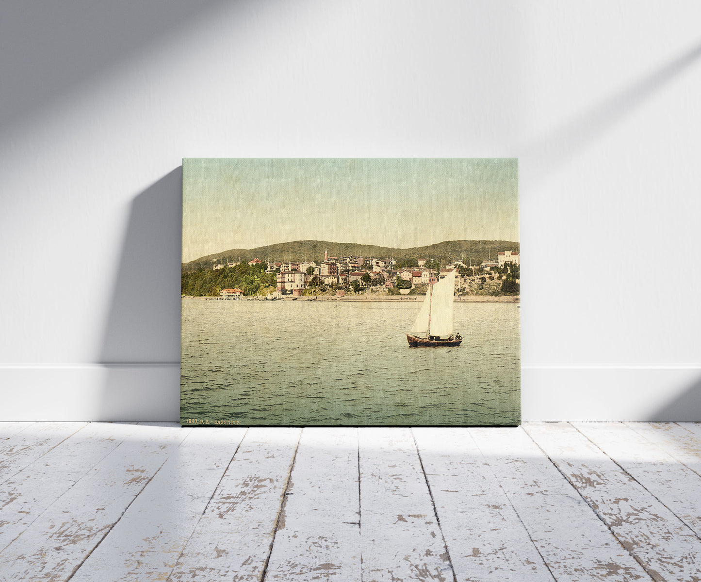 A picture of Sassnitz, seen from the water, Isle of Rugen, Germany, a mockup of the print leaning against a wall