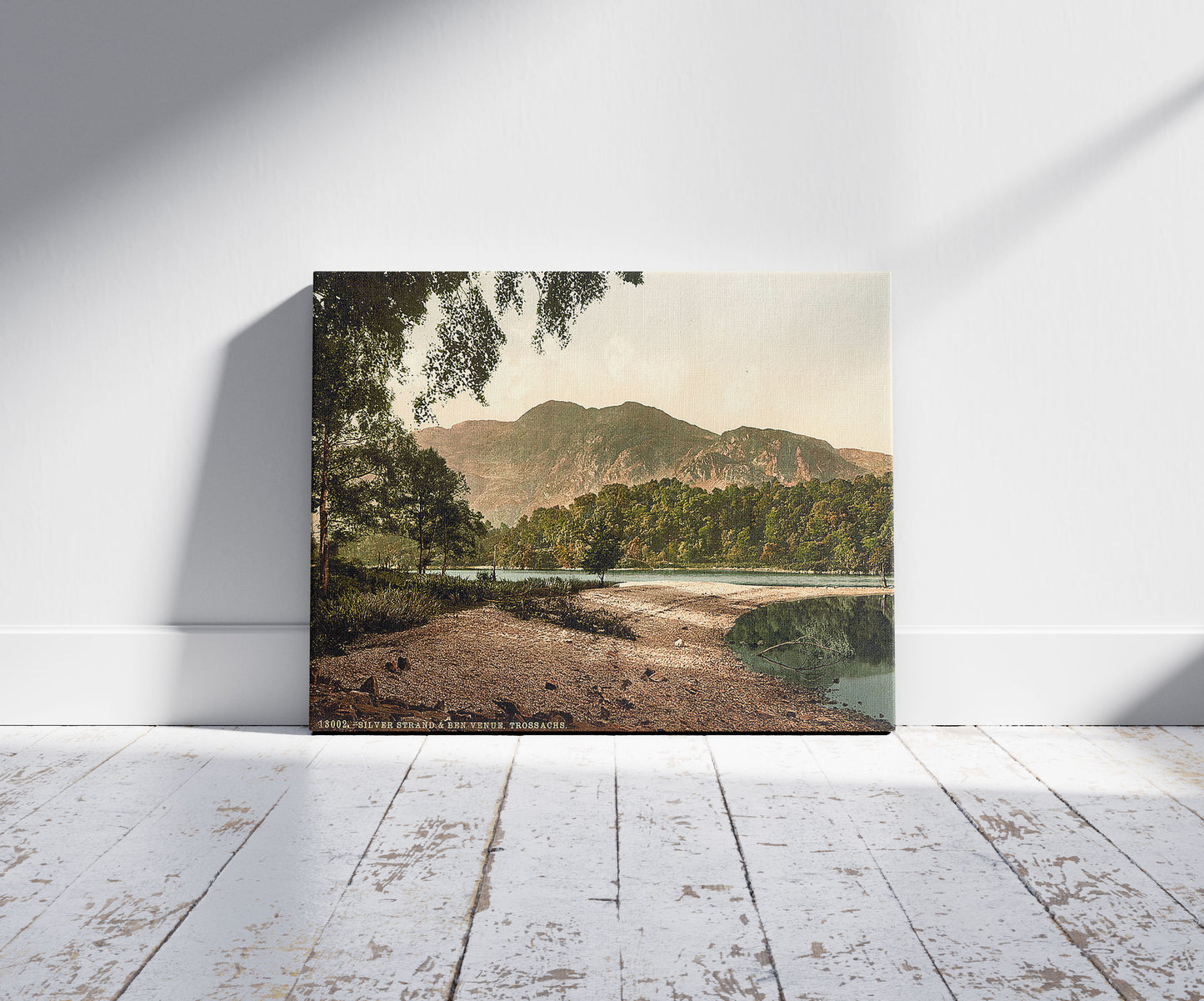 A picture of Silver Strand and Ben Venue, Trossachs, Scotland, a mockup of the print leaning against a wall