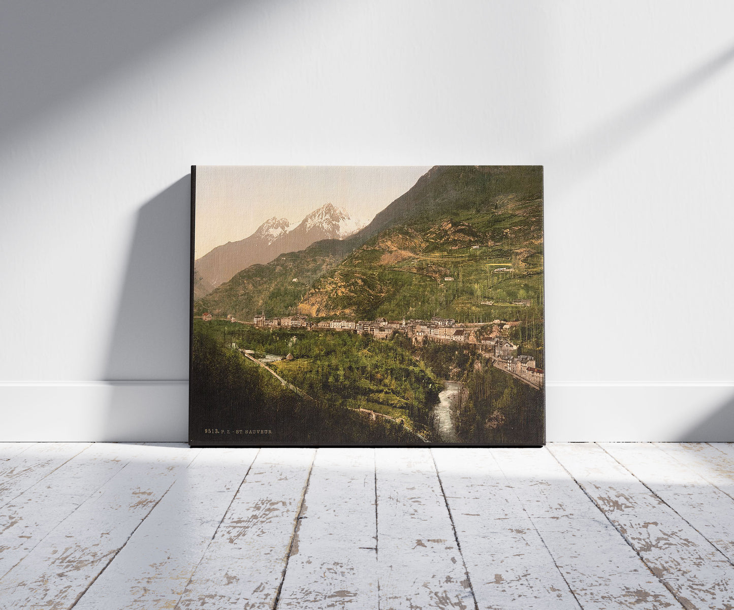 A picture of St. Sauveur, Pyrenees, France, a mockup of the print leaning against a wall