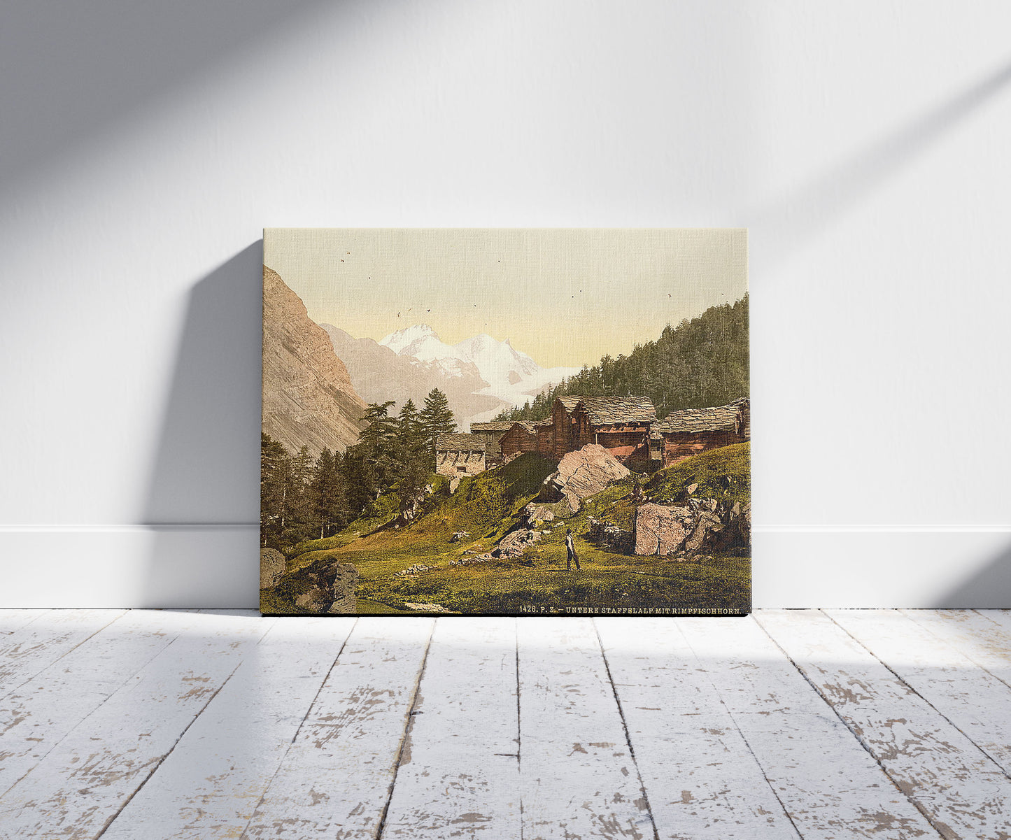 A picture of Staffel Alp and Rimpfischhorn, with chalets, Valais, Alps of, Switzerland, a mockup of the print leaning against a wall