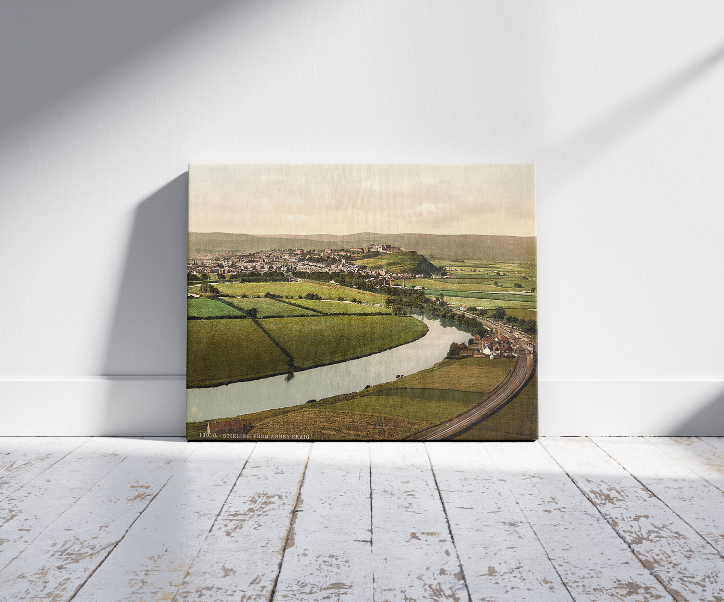 A picture of Stirling, from Abbey Craig, Scotland, a mockup of the print leaning against a wall