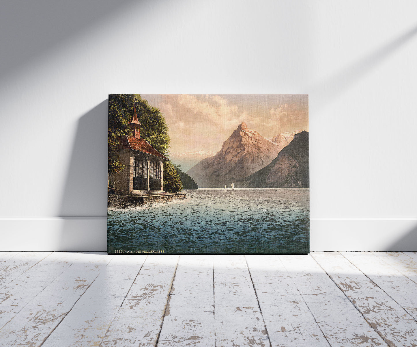 A picture of Tell's Chapel, evening view, Lake Lucerne, Switzerland, a mockup of the print leaning against a wall