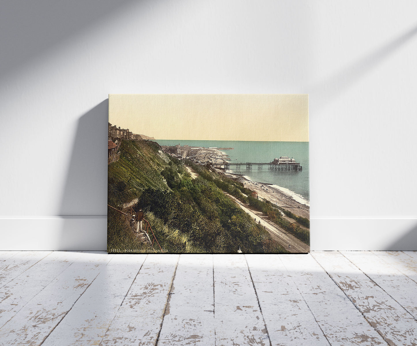 A picture of The beach and pier, Folkestone, England