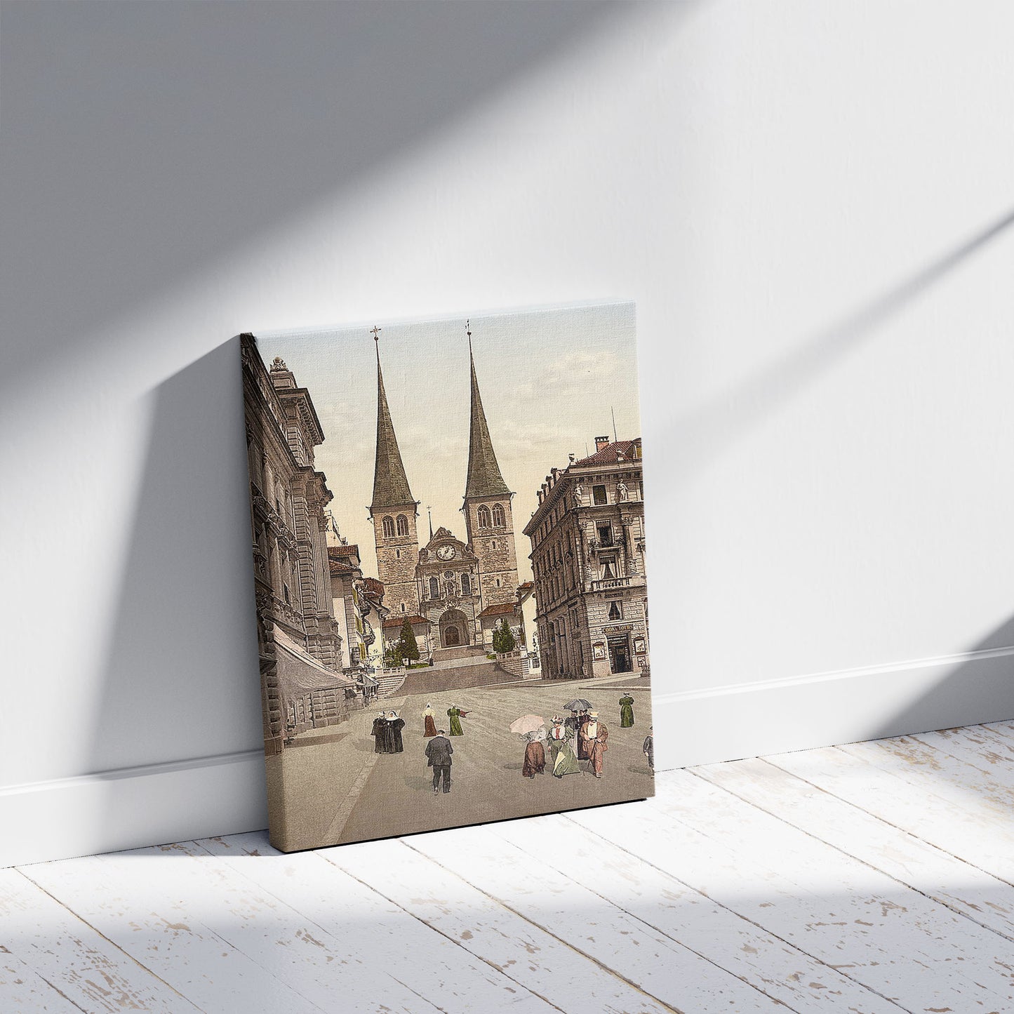 A picture of The cathedral, Lucerne, Switzerland, a mockup of the print leaning against a wall