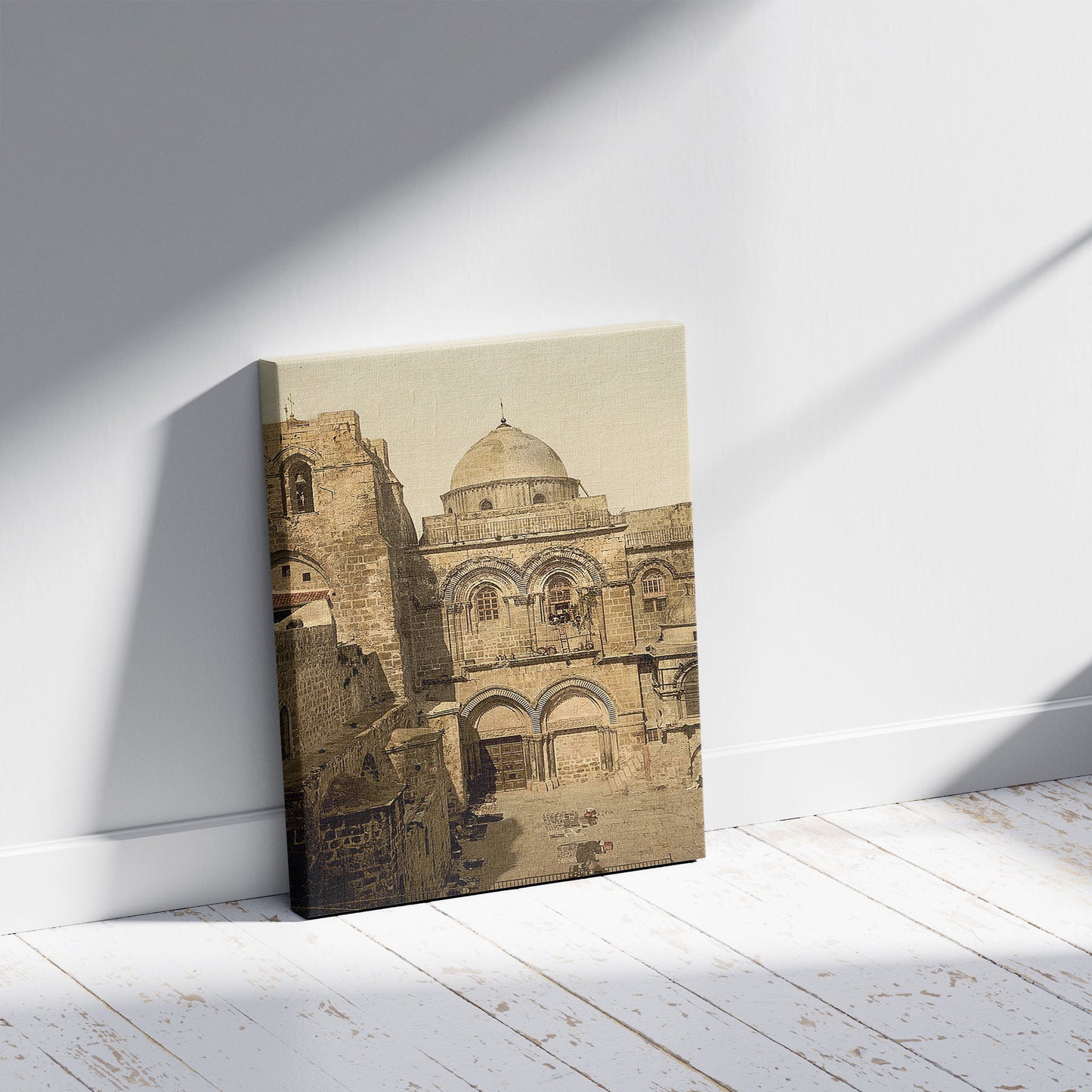 A picture of The front of the Holy Sepulchre, Jerusalem, Holy Land, a mockup of the print leaning against a wall