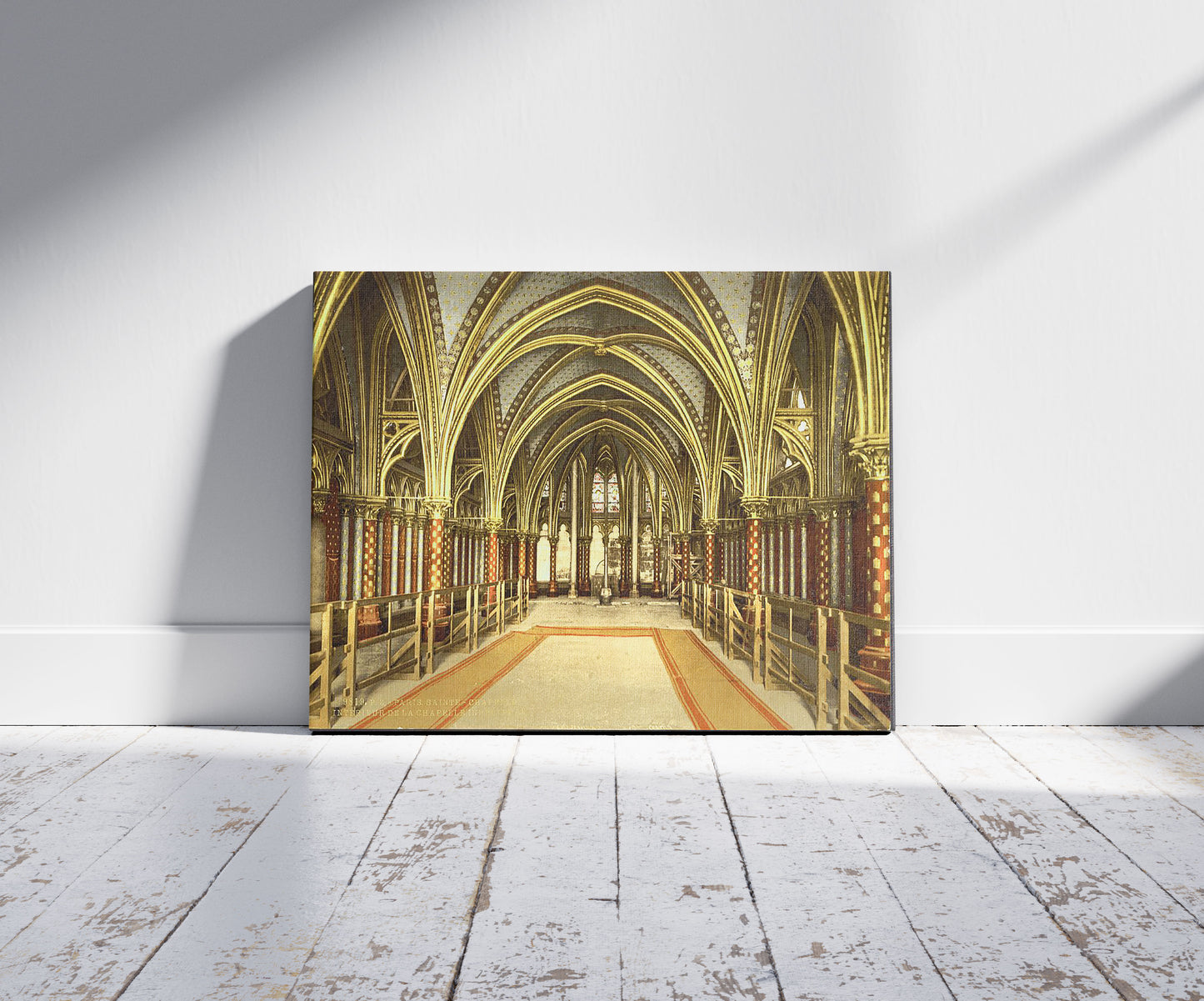 A picture of The Holy Chapel (i.e., Sainte-Chappelle), interior of lower chapel, Paris, France, a mockup of the print leaning against a wall
