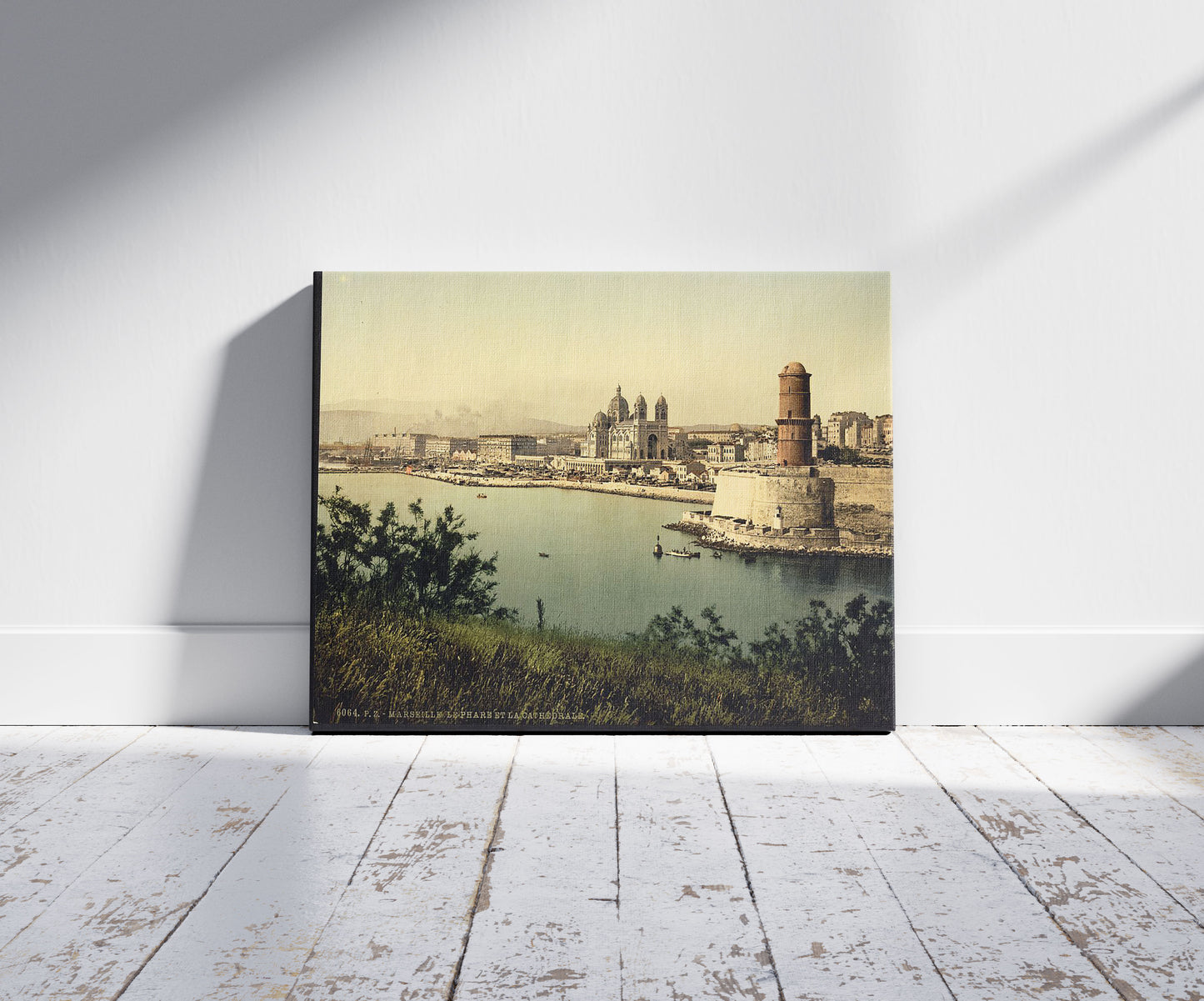 A picture of The lighthouse and cathedral, Marseilles, France, a mockup of the print leaning against a wall