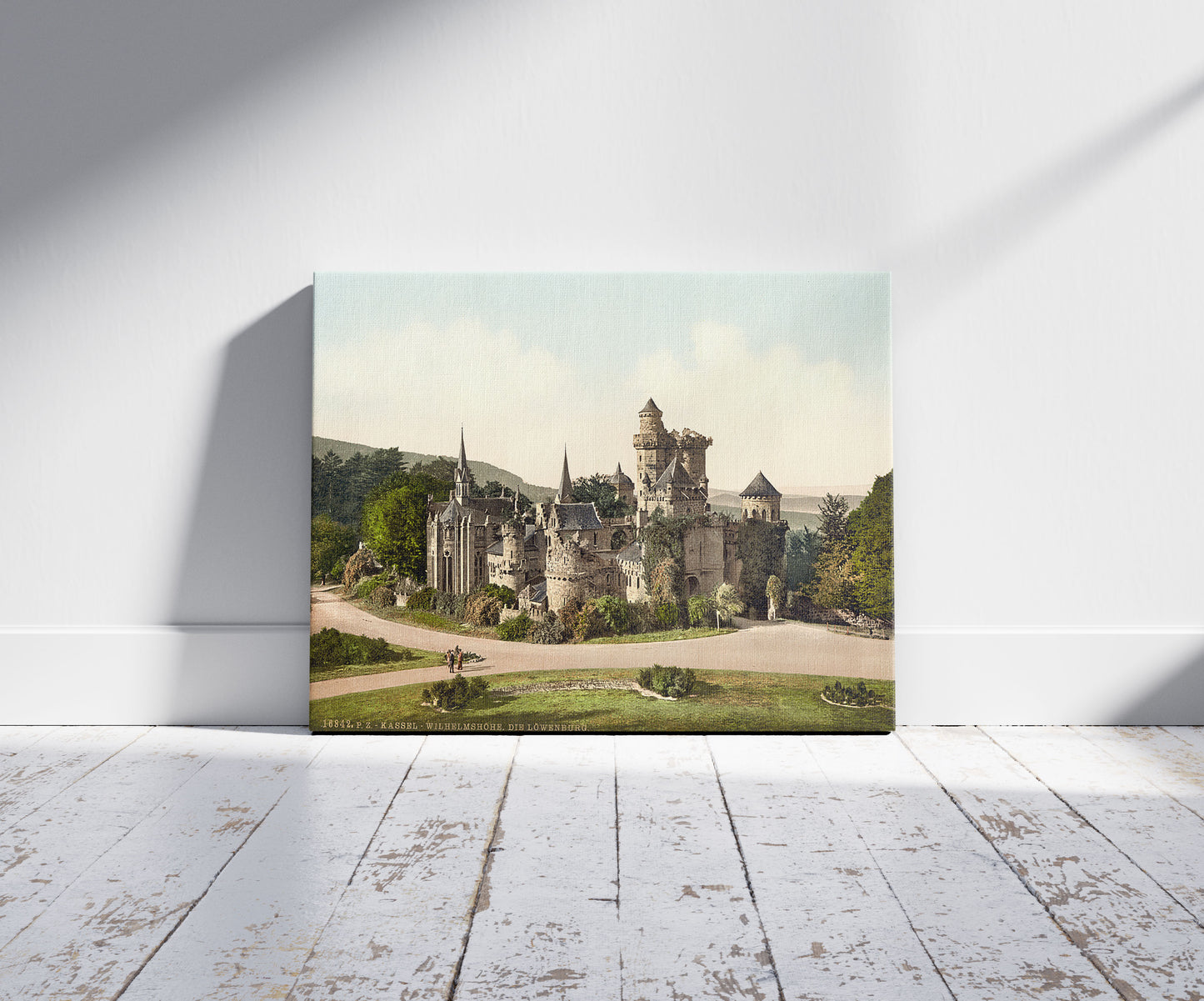 A picture of The Lower Castle (i.e., Lions Castle), Wilhelmshohe, Cassel (i.e., Kassel), Hesse-Nassau, Germany, a mockup of the print leaning against a wall