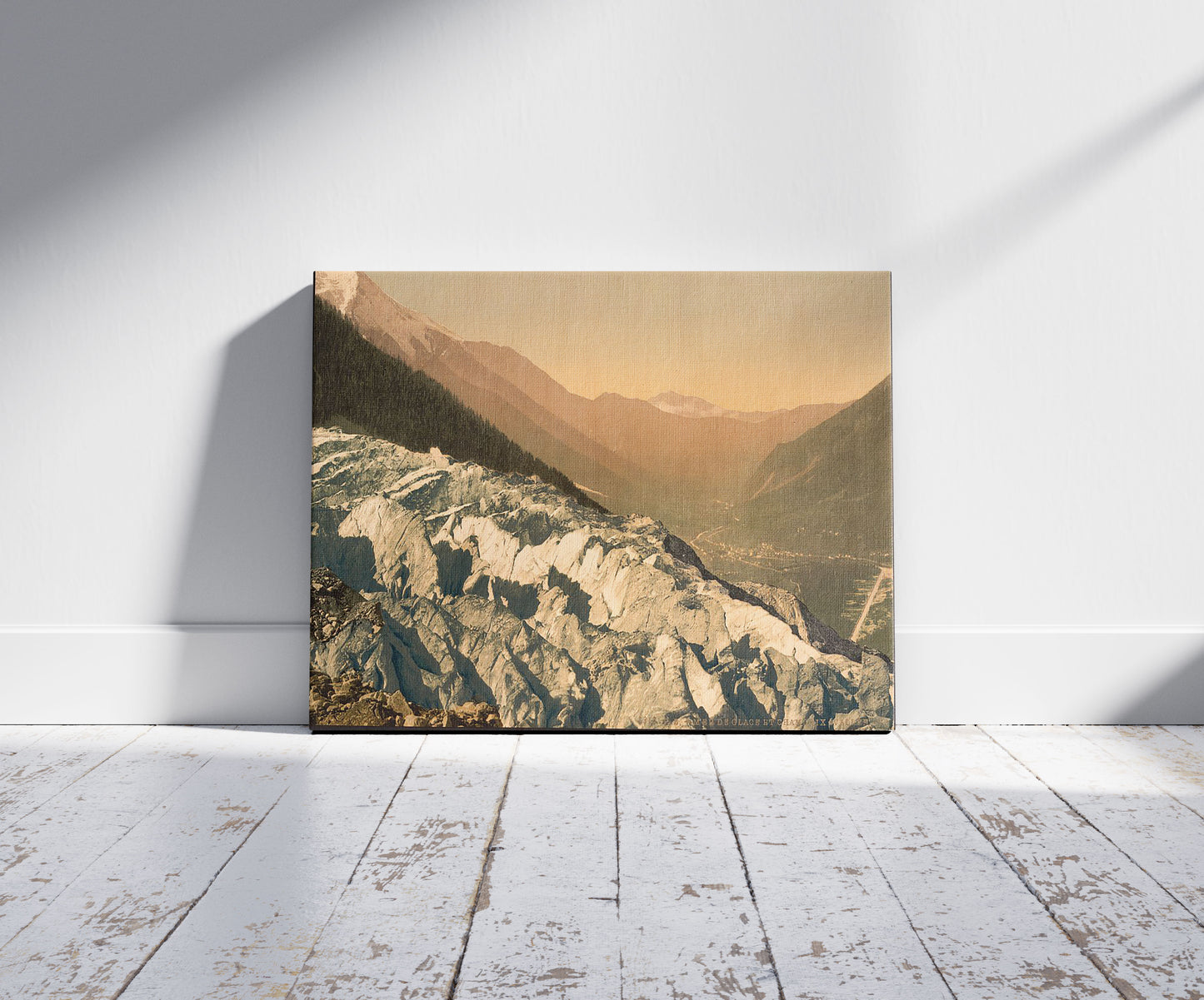 A picture of The Mer de Glace, and the Valley of Chamonix as seen from the Chapeau, i.e., Chapieux, Chamonix Valley, France, a mockup of the print leaning against a wall