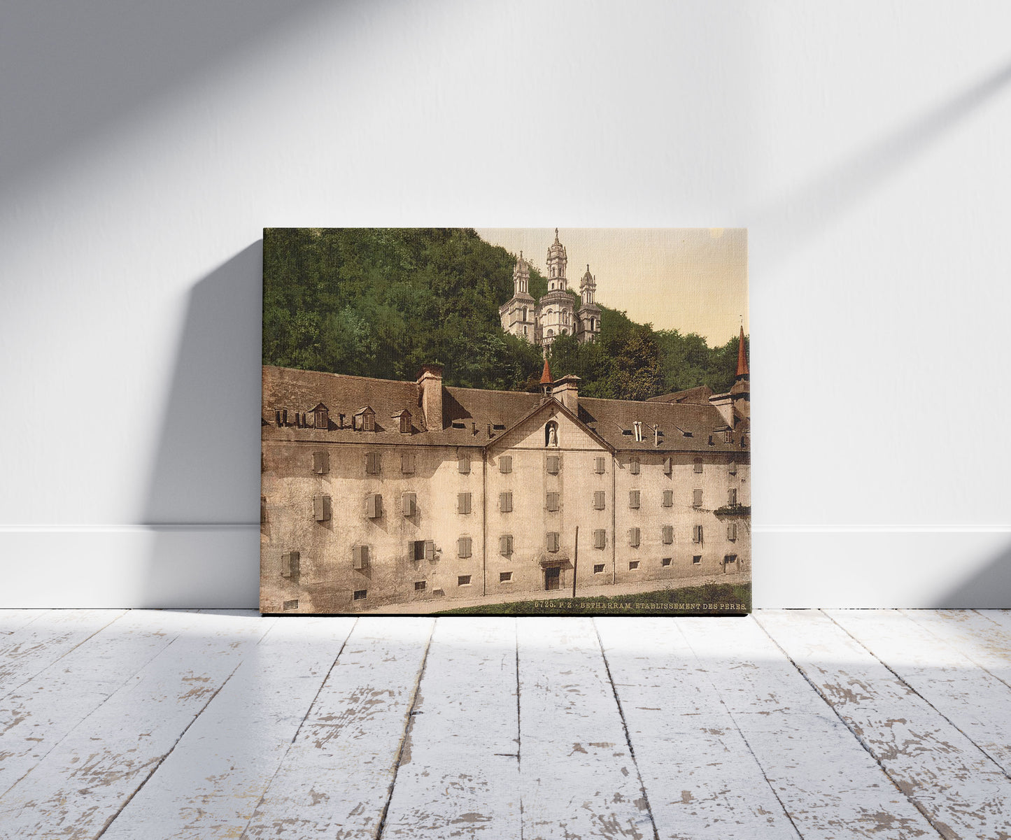 A picture of The monastery, Bétharram, Pyrenees, France, a mockup of the print leaning against a wall