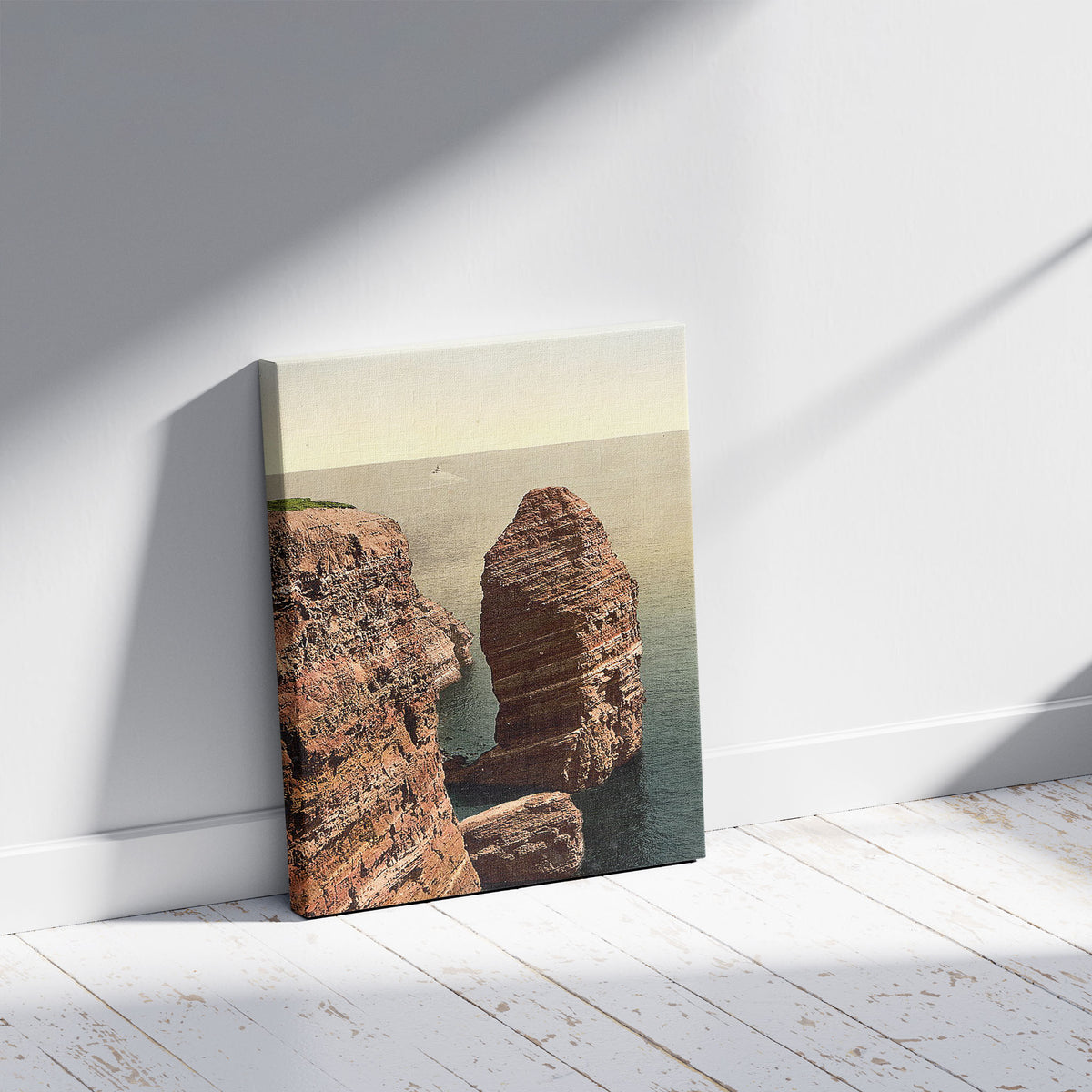 A picture of The "Monk" from above, Helgoland, Germany, a mockup of the print leaning against a wall