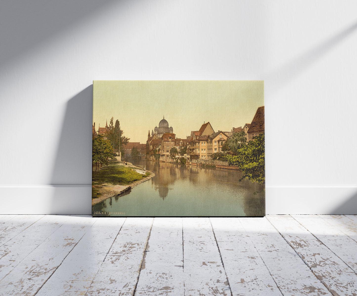 A picture of The Pegnitz shore and synagogue, Nuremberg, Bavaria, Germany, a mockup of the print leaning against a wall