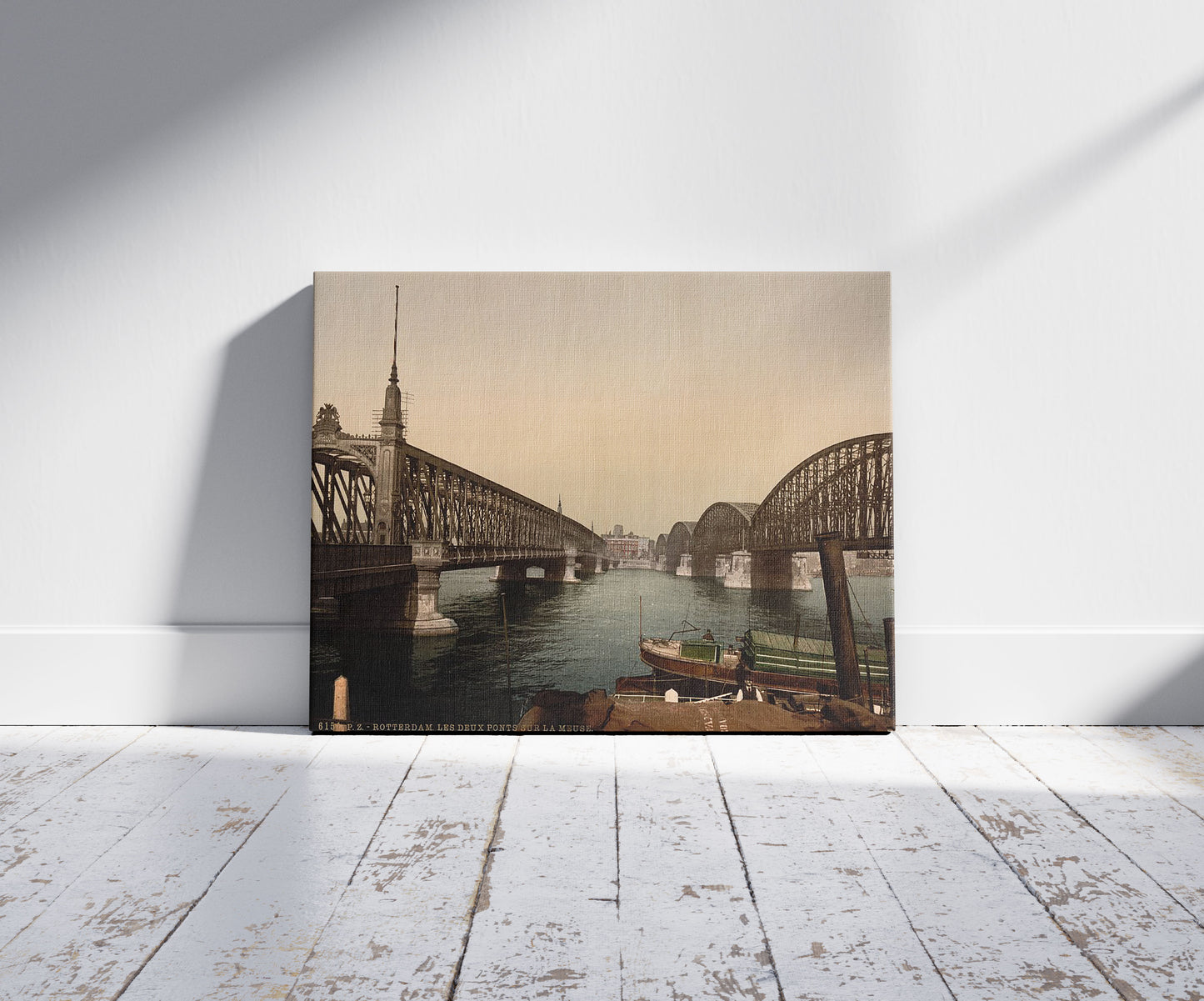 A picture of The two bridges on the Meuse, Rotterdam, Holland, a mockup of the print leaning against a wall
