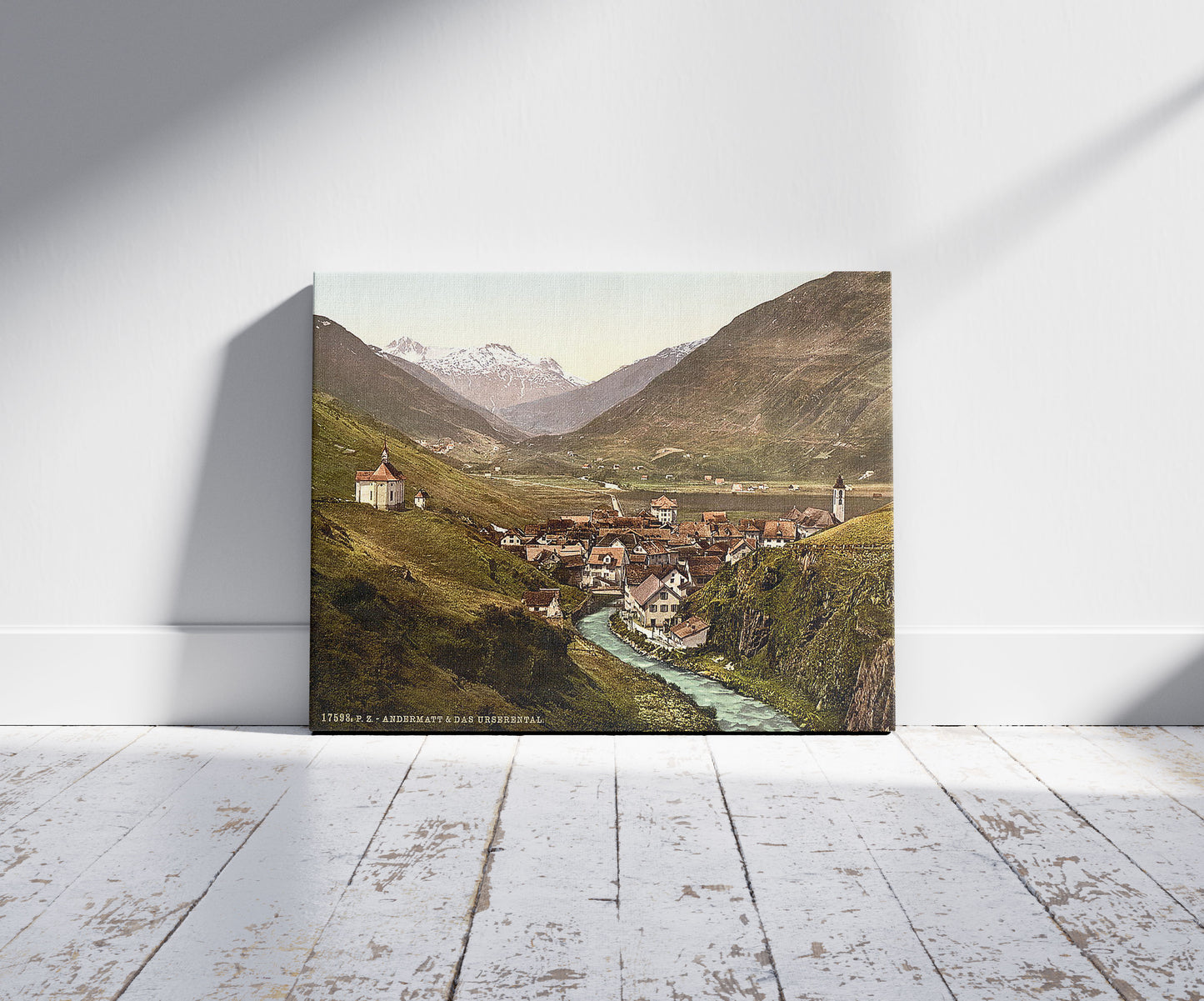 A picture of The Ursern Valley, Andermatt, Switzerland, a mockup of the print leaning against a wall