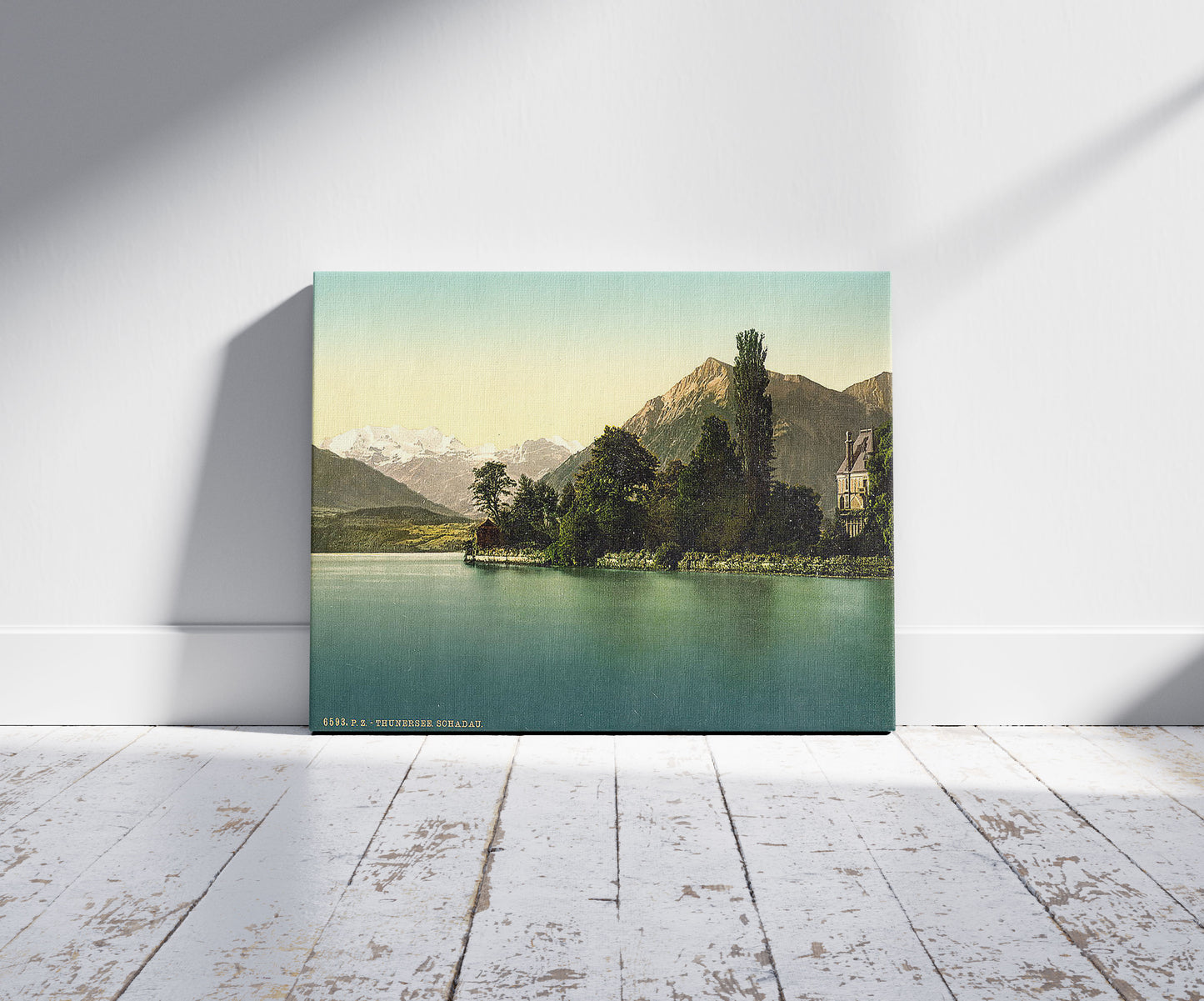 A picture of Thun, Shadau, Bernese Oberland, Switzerland, a mockup of the print leaning against a wall