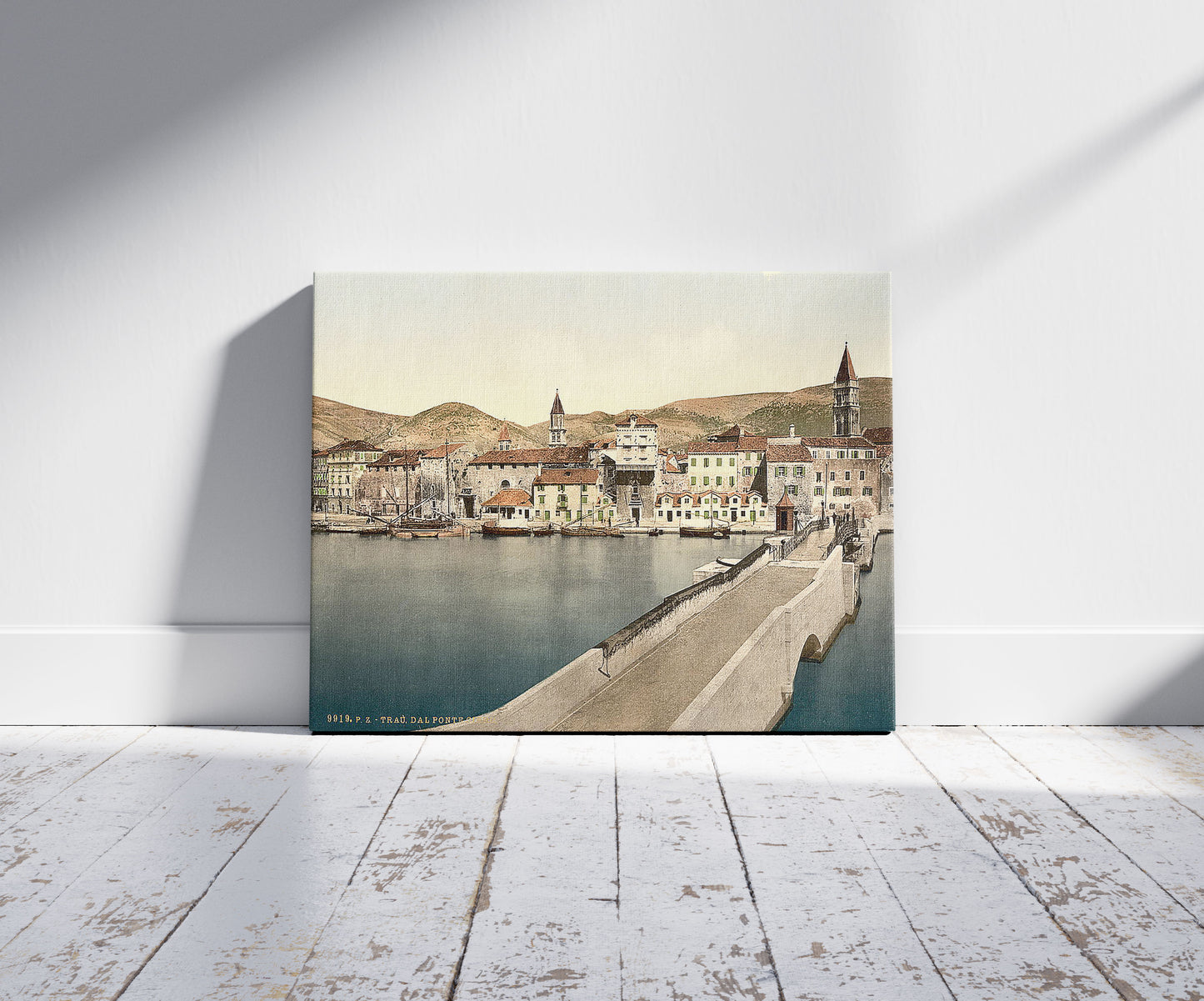A picture of Traû, the Ciero Bridge, Dalmatia, Austro-Hungary, a mockup of the print leaning against a wall