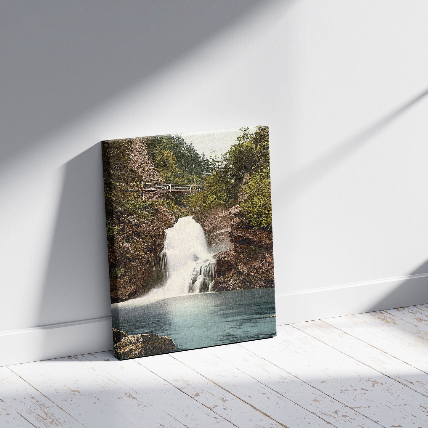 A picture of Triglav, Rothwein (i.e., Rotwein), and waterfall, Carniola, Austro-Hungary, a mockup of the print leaning against a wall