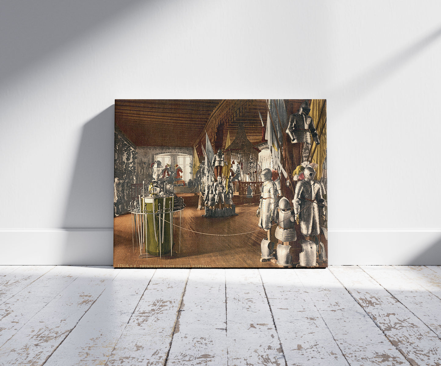 A picture of Veste Coburg Rostsaal (i.e., Rüstsaal), Thuringia, Germany, a mockup of the print leaning against a wall