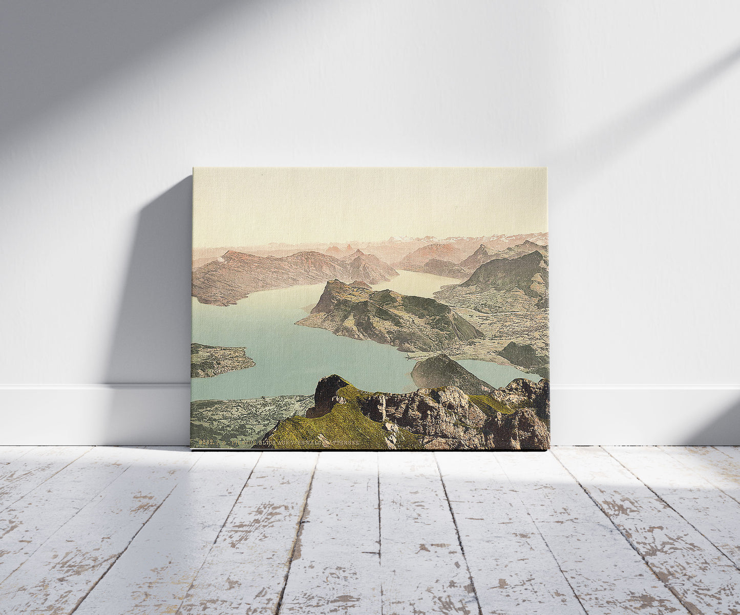 A picture of View over the Lake of Four Cantons, Pilatus, Switzerland, a mockup of the print leaning against a wall