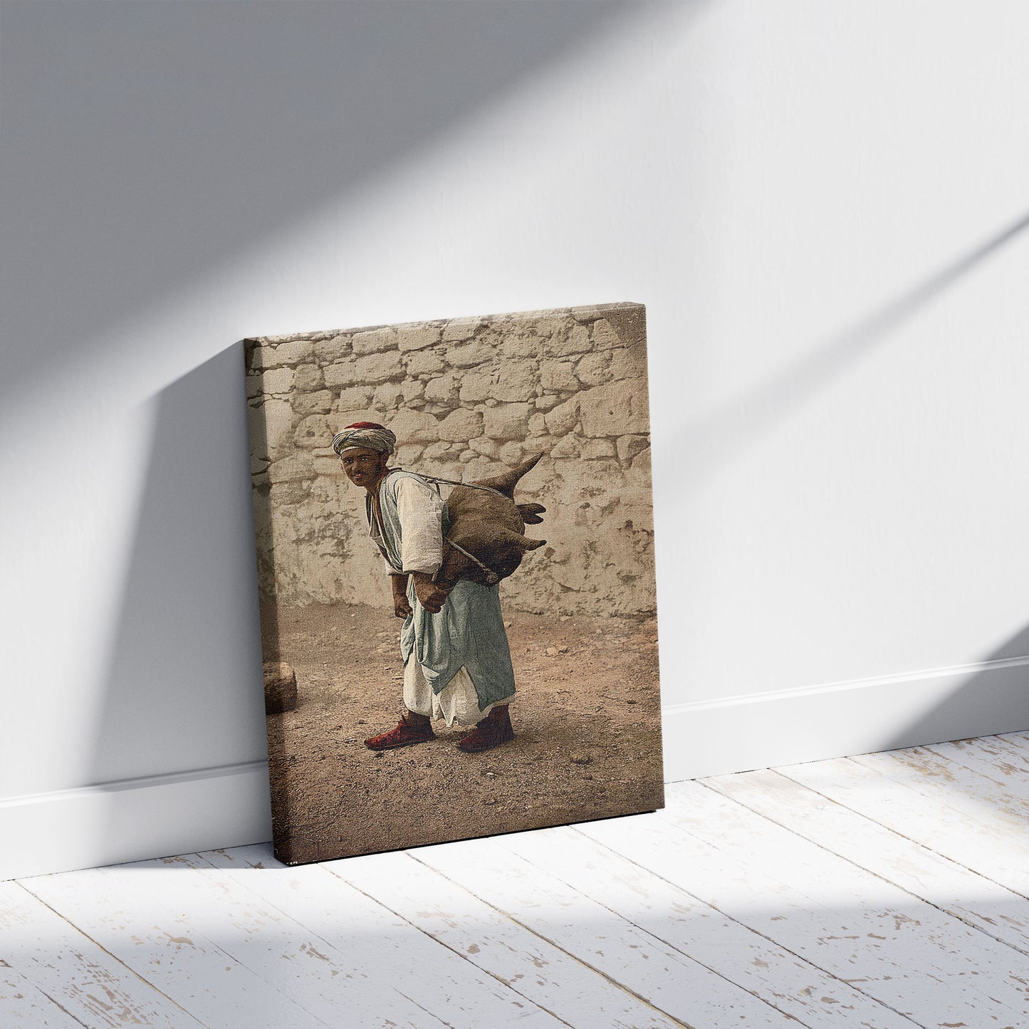 A picture of Water carrier of Jerusalem, Holy Land, a mockup of the print leaning against a wall