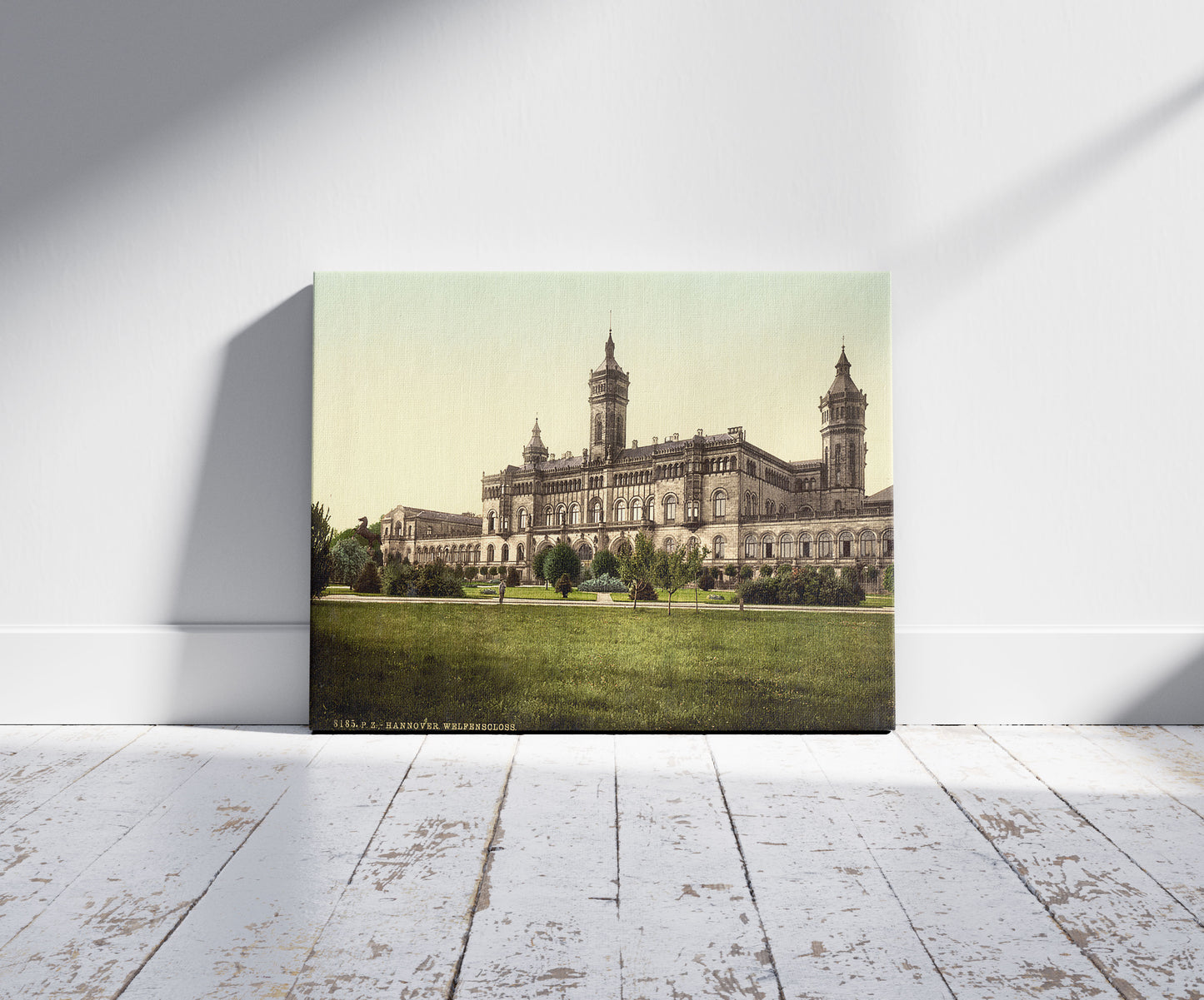 A picture of Welfenschloss, Hanover, Hanover, Germany, a mockup of the print leaning against a wall