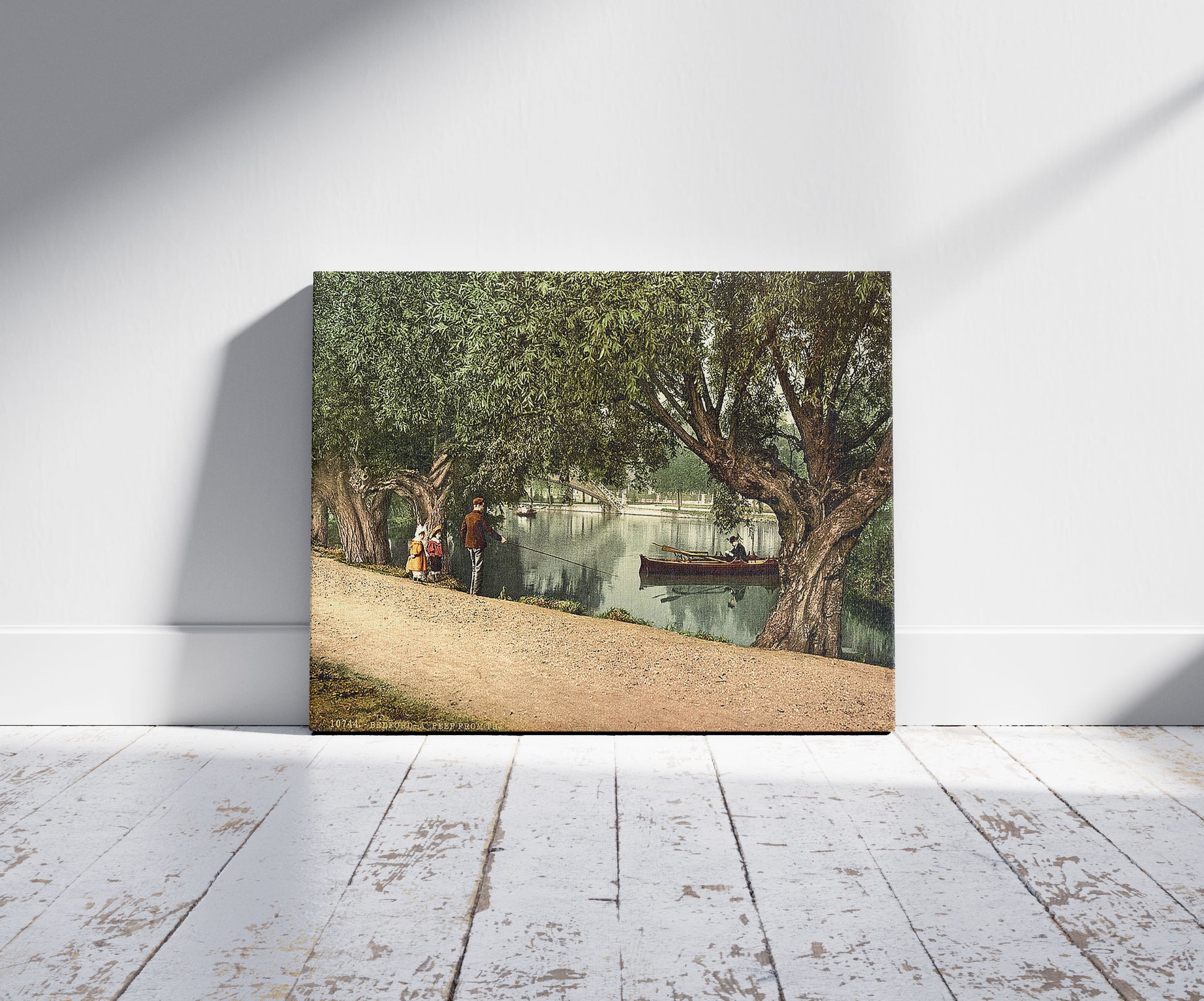 A picture of A "Peep" from the recreation grounds, Bedford, England, a mockup of the print leaning against a wall