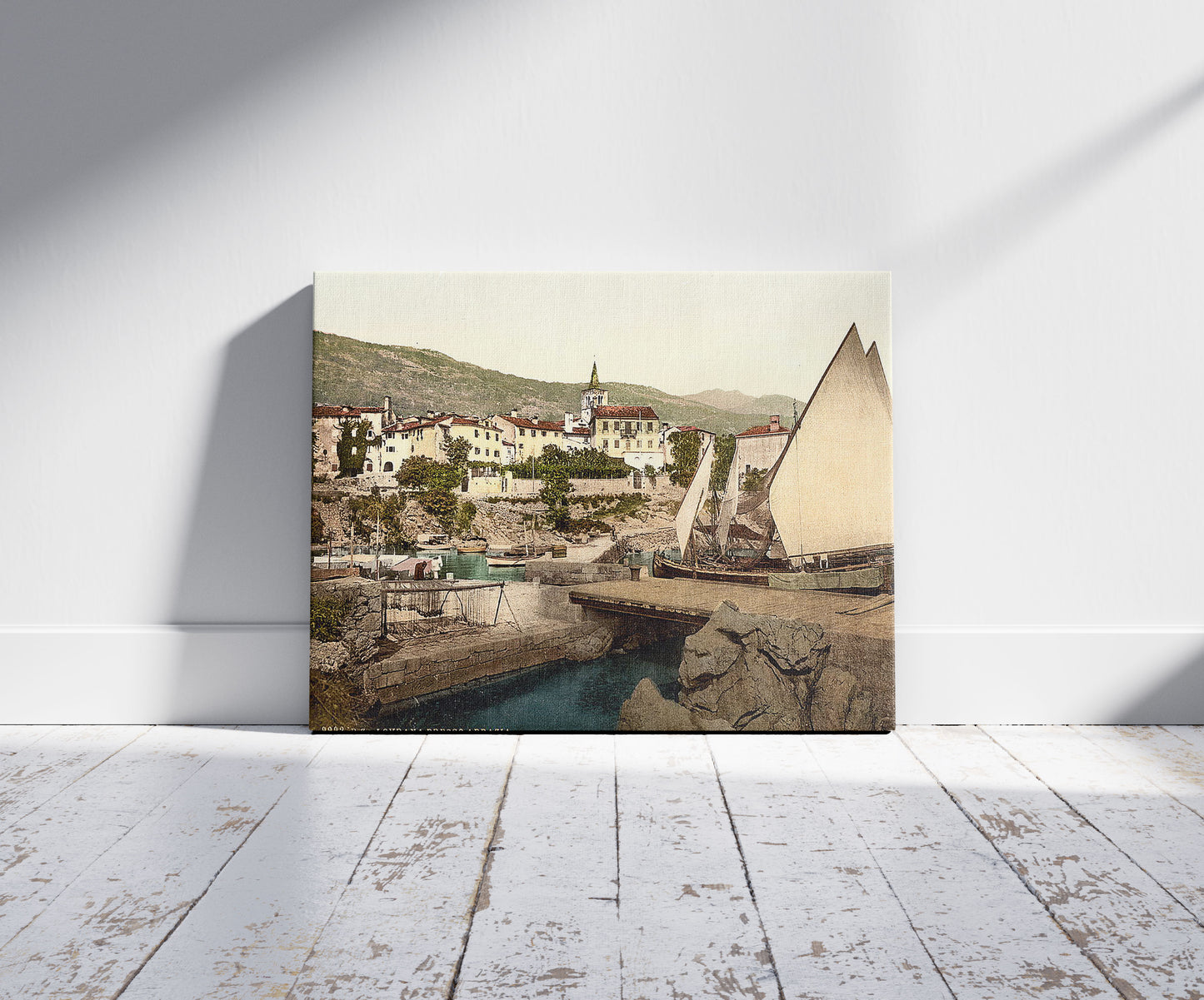 A picture of Abbazia, Lovrana near Abbazia, Istria, Austro-Hungary, a mockup of the print leaning against a wall