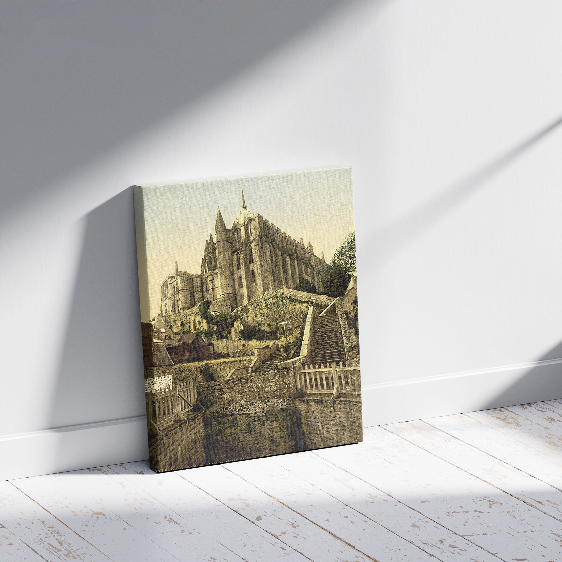 A picture of Abbey from the ramparts, Mont St. Michel, France, a mockup of the print leaning against a wall