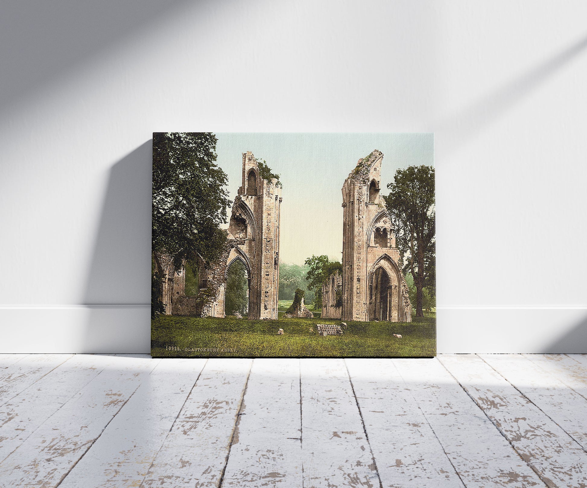 A picture of Abbey, Glastonbury, England, a mockup of the print leaning against a wall