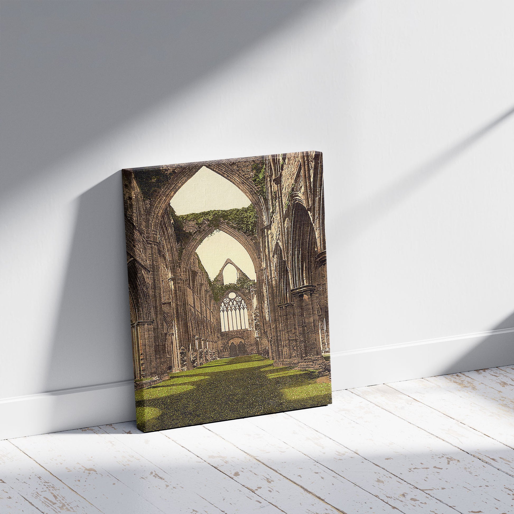A picture of Abbey interior, looking W., Tintern, England, a mockup of the print leaning against a wall